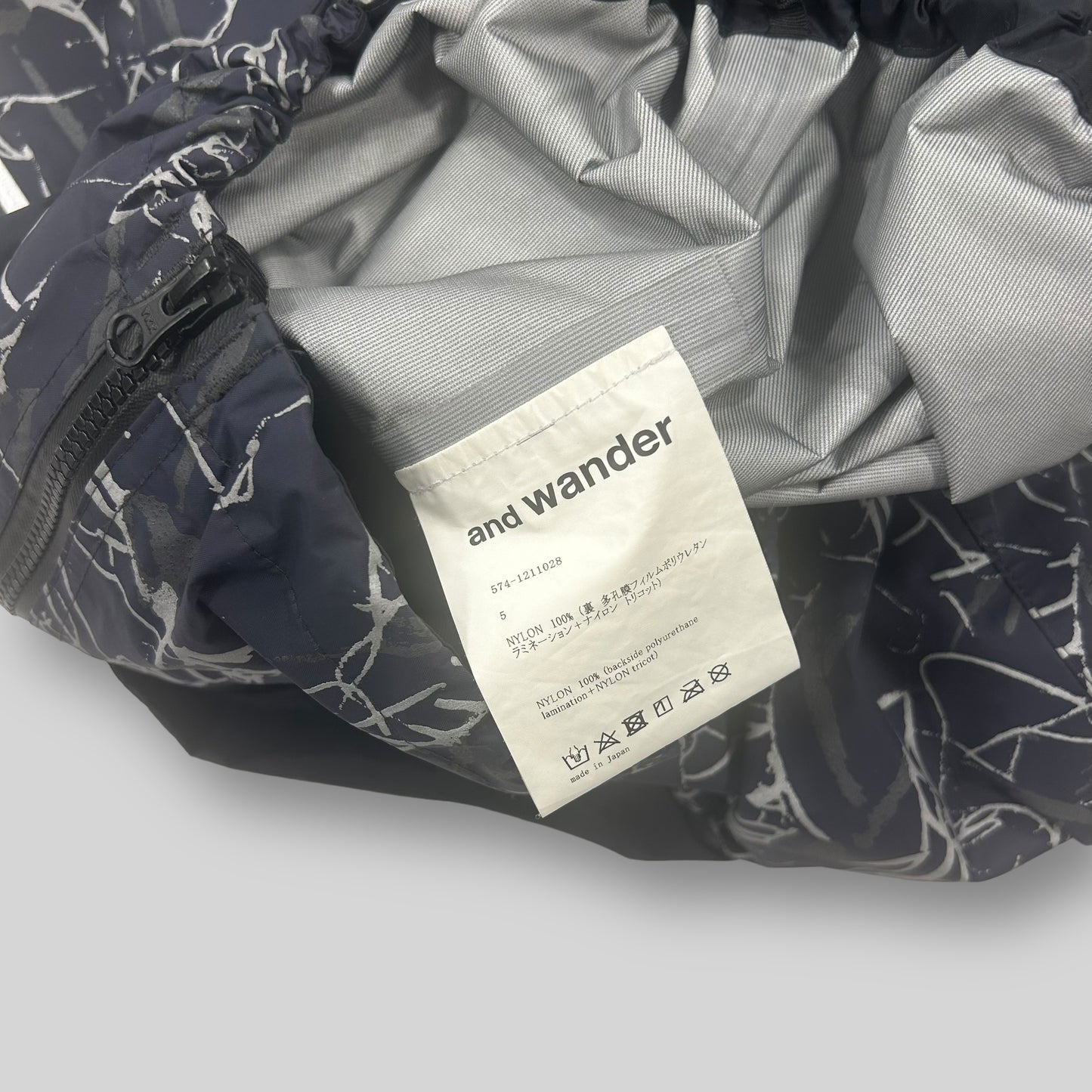 And Wander Reflective Printed Rain Jacket ‘Charcoal’(Fits XL)