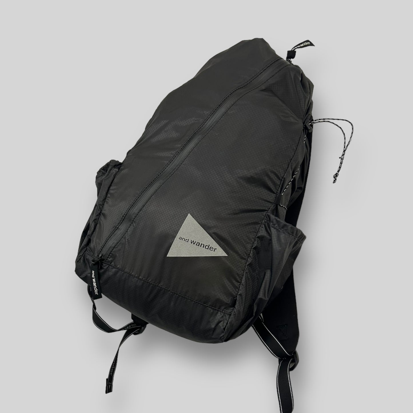 And Wander SIL Diagonal Zip Back Pack Black