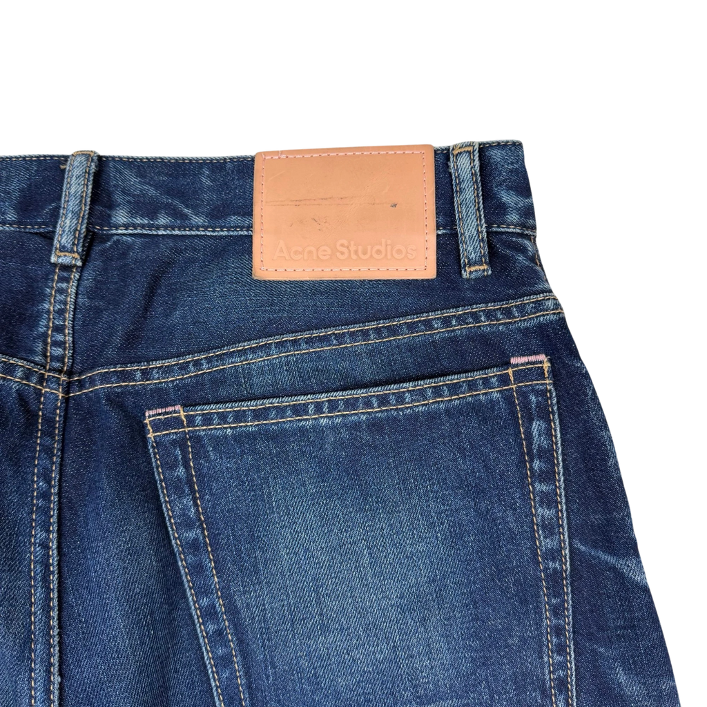 Zenno Archive Acne Studios dark wash denim jeans featuring a tan leather brand patch on the back waistband