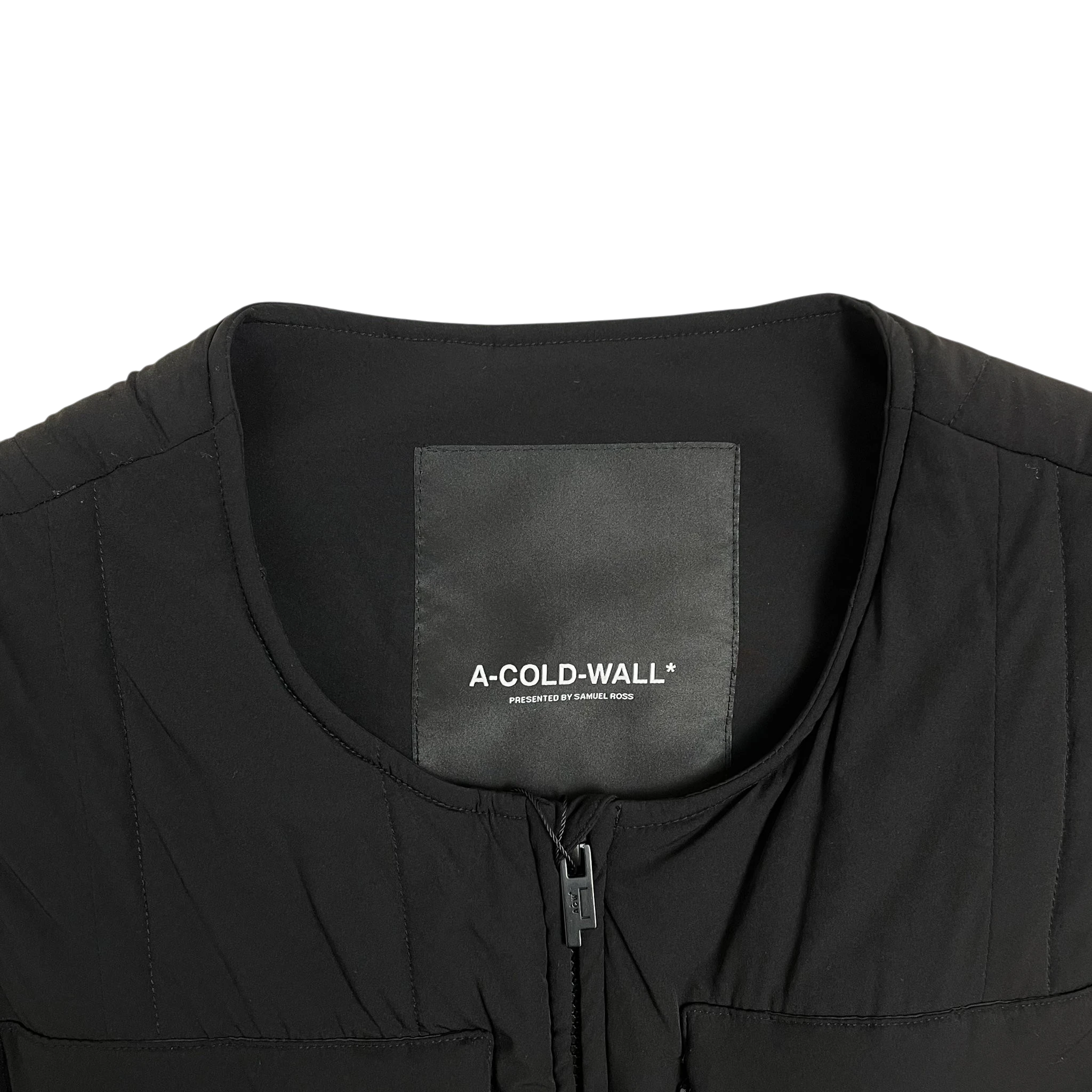 Zenno Archive A-COLD-WALL* black technical puffer vest featuring a branded neck label and front zipper detail
