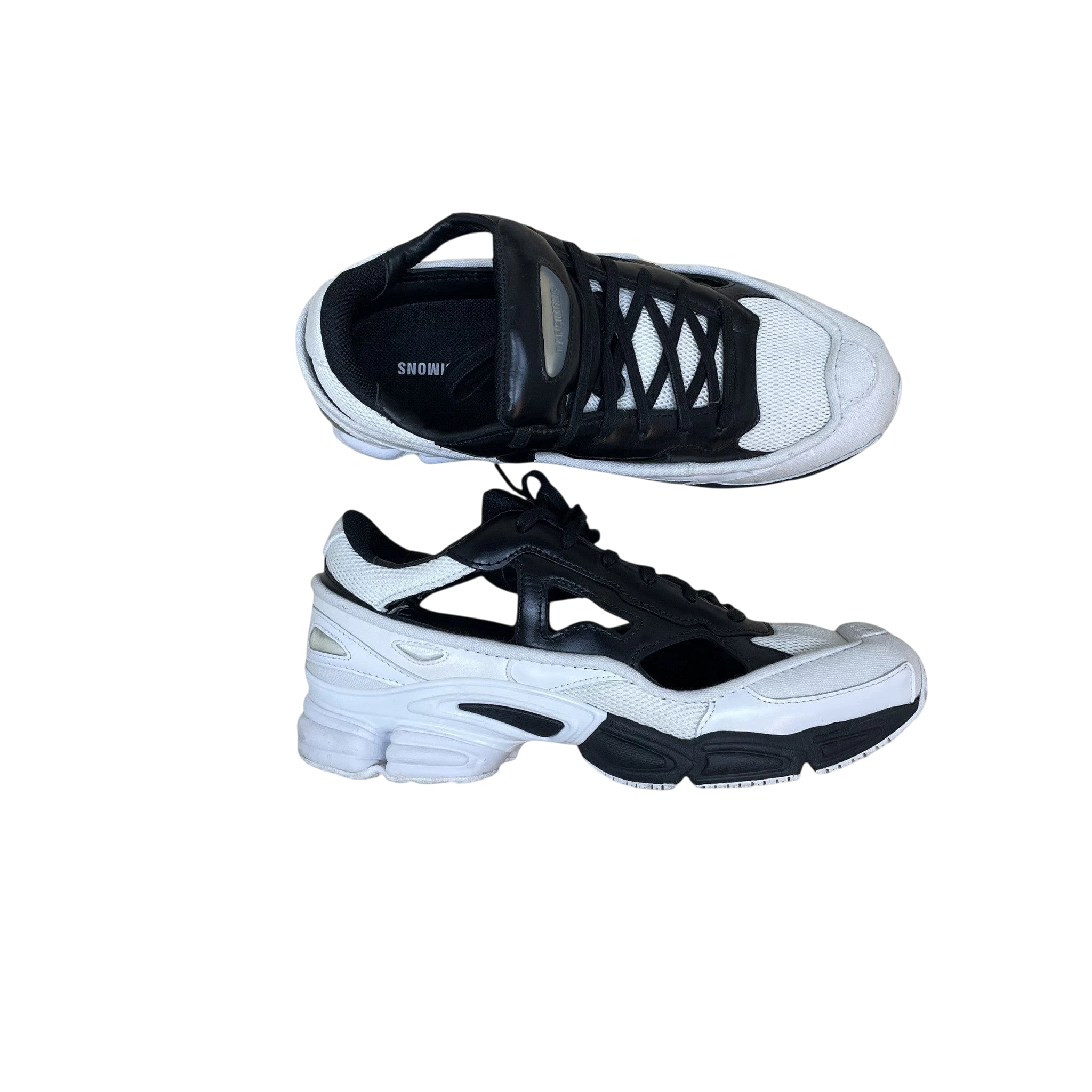 Zenno Archive Adidas x Raf Simons AW18 Ozweego Replicant sneakers in black and cream with cutout side details.