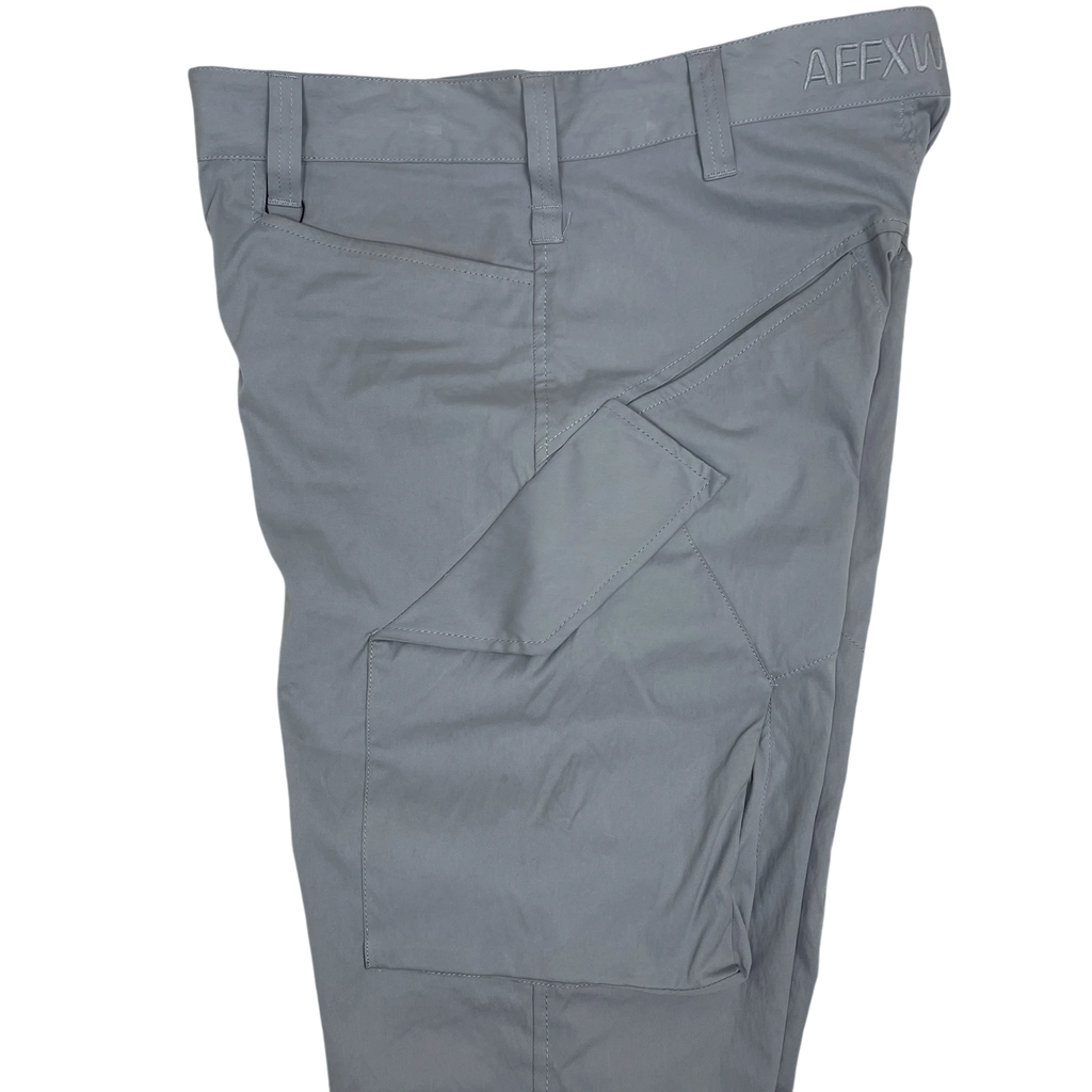 Zenno Archive AFFXWRKS grey nylon cargo pants featuring a side utility pocket and branded waistband detail.