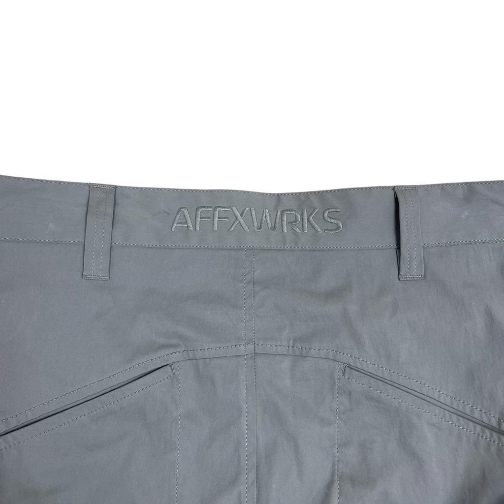 Zenno Archive grey nylon cargo pants featuring an embroidered AFFXWRKS logo on the waistband