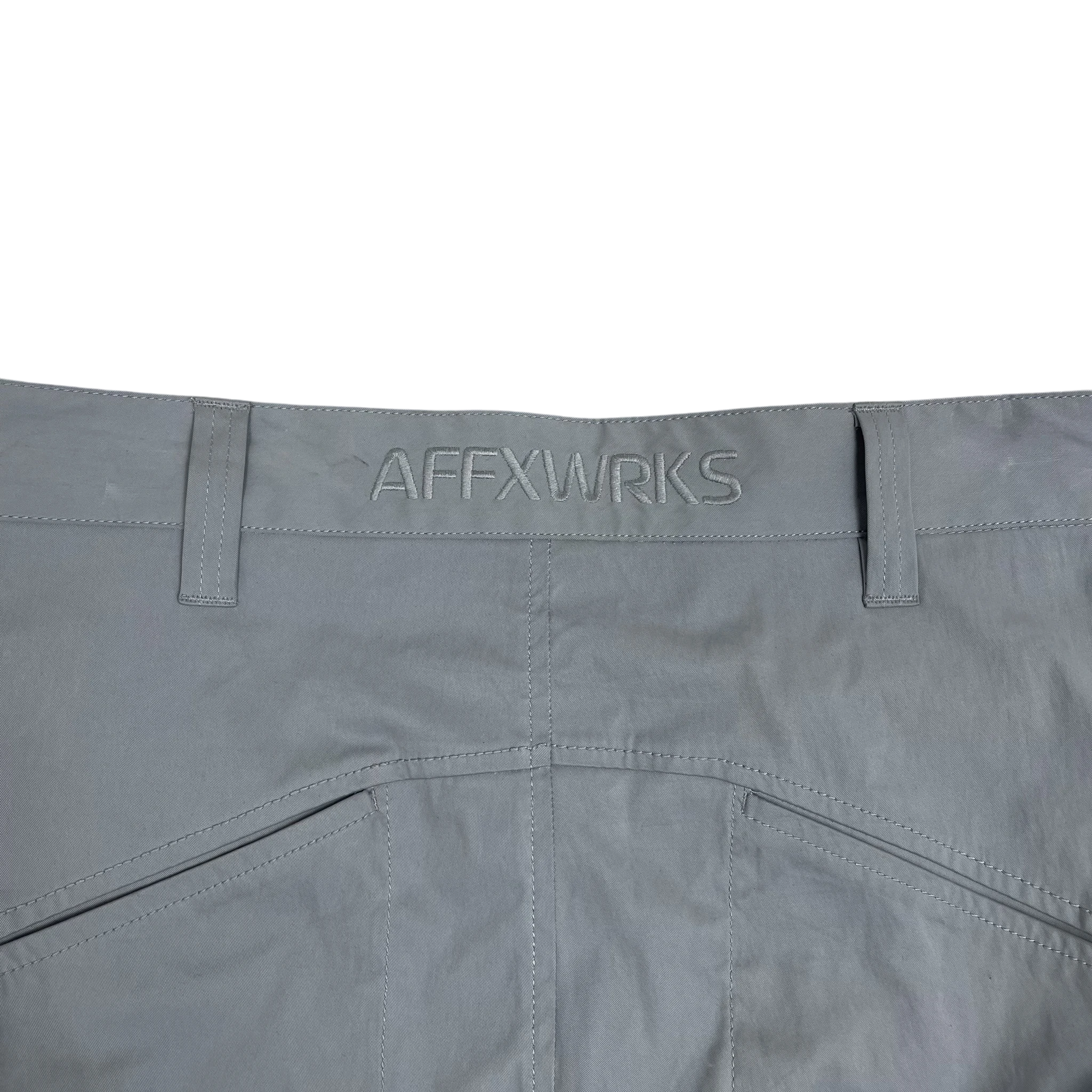 Zenno Archive grey nylon cargo pants featuring an embroidered AFFXWRKS logo on the waistband
