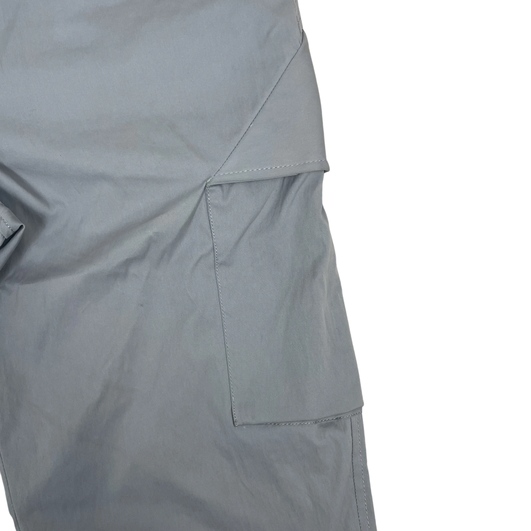 Zenno Archive AFFXWRKS grey nylon cargo pants featuring a sleek side pocket detail on a textured background.