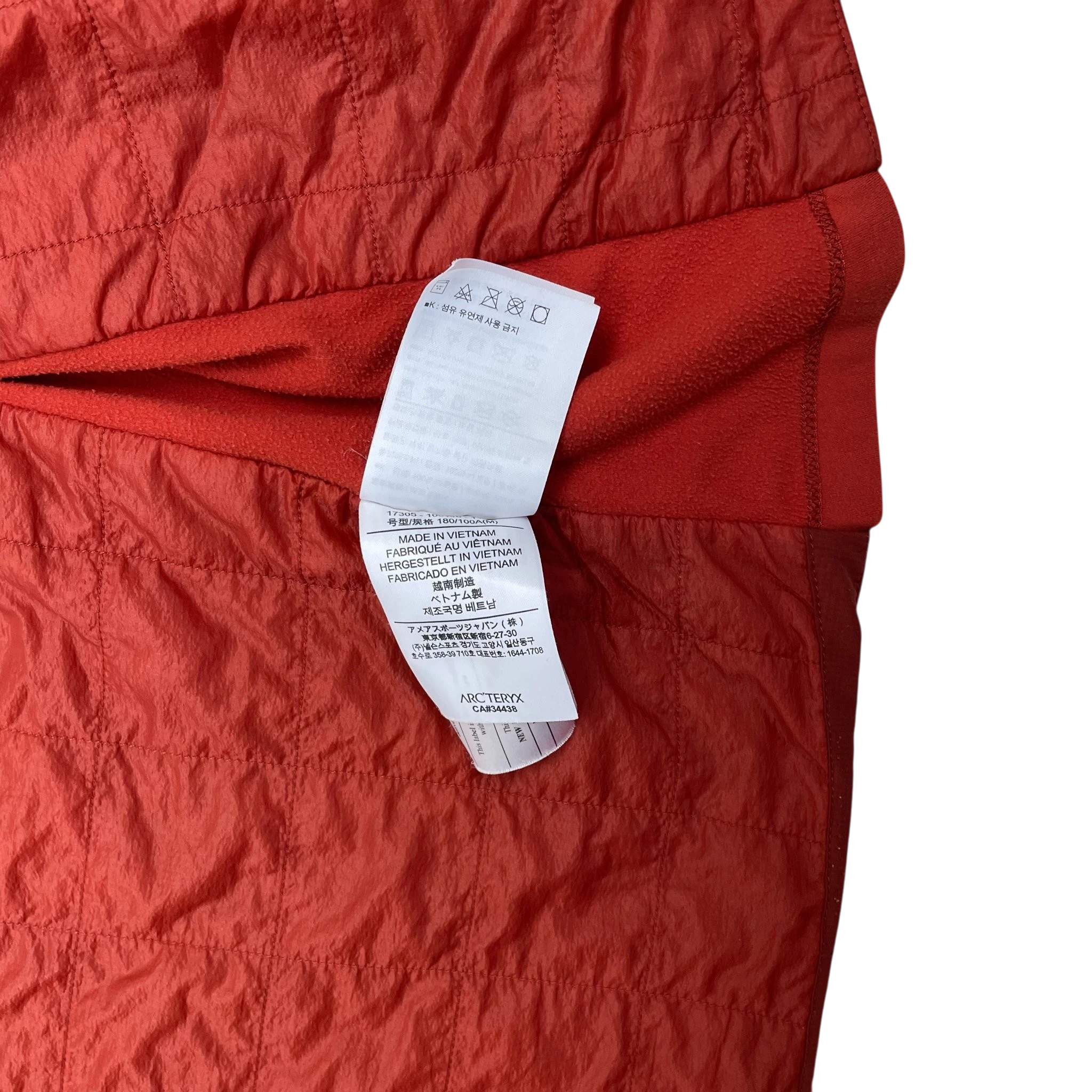 Zenno Archive Arc’teryx Atom SL red jacket interior care label and quilted fabric texture