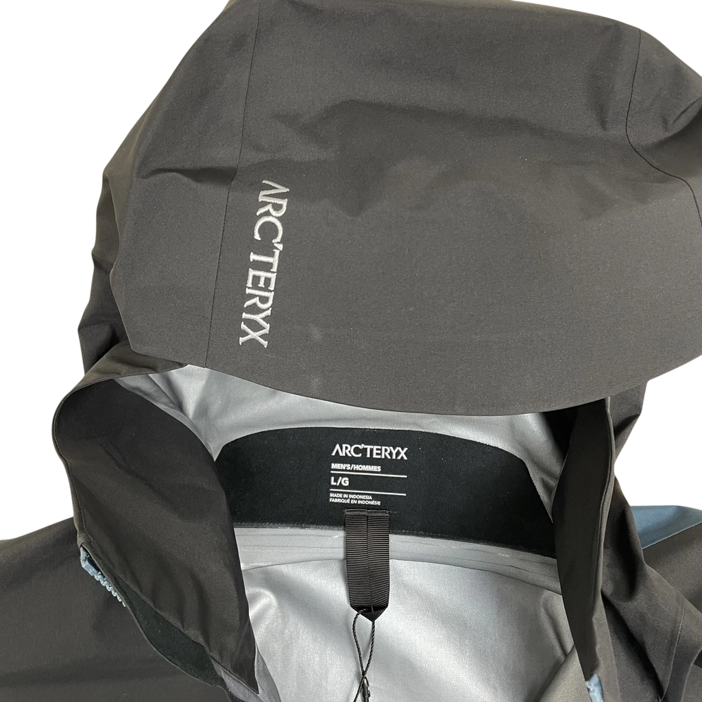 Zenno Archive Arc’teryx Beta Goretex jacket in black and blue with hood logo detail and interior size label