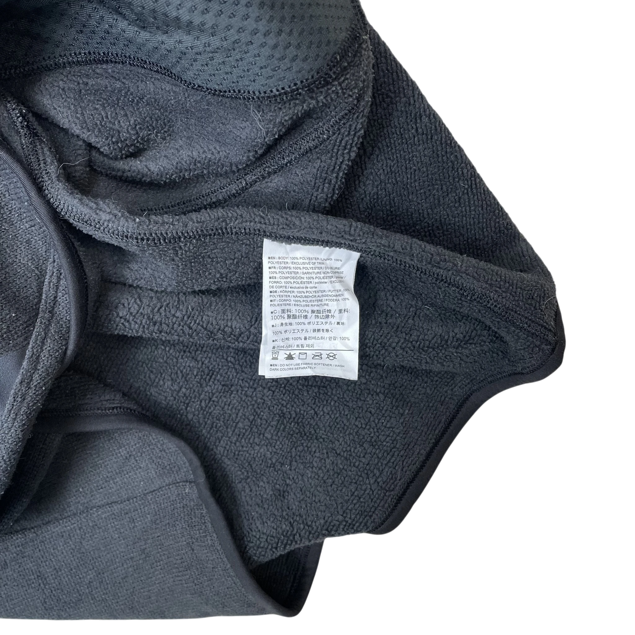 Zenno Archive Arcteryx Covert fleece vest in grey showing the interior fabric texture and care label details