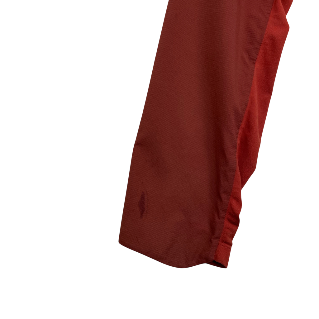 Zenno Archive Arc’teryx Atom SL red jacket sleeve showing a small stain on the fabric