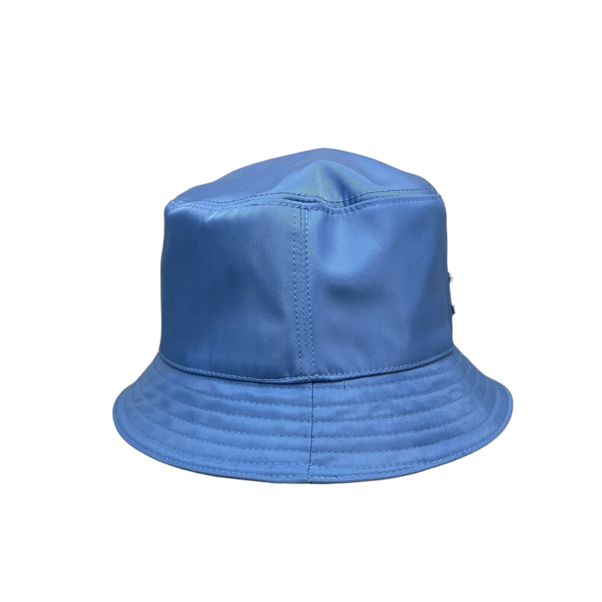 Zenno Archive baby blue nylon bucket hat featuring the iconic Prada triangle logo plaque on the side.