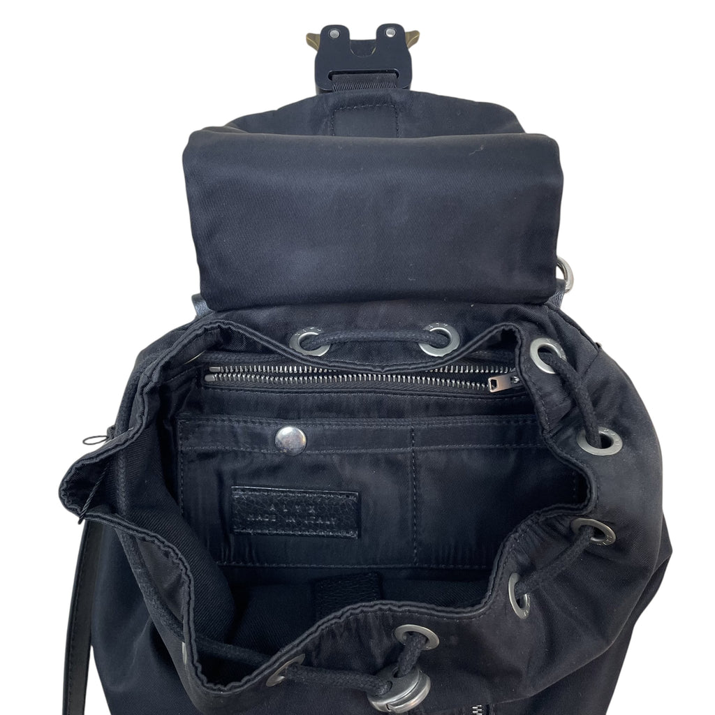 Zenno Archive black nylon backpack with signature metal buckle closure and drawstring top opening