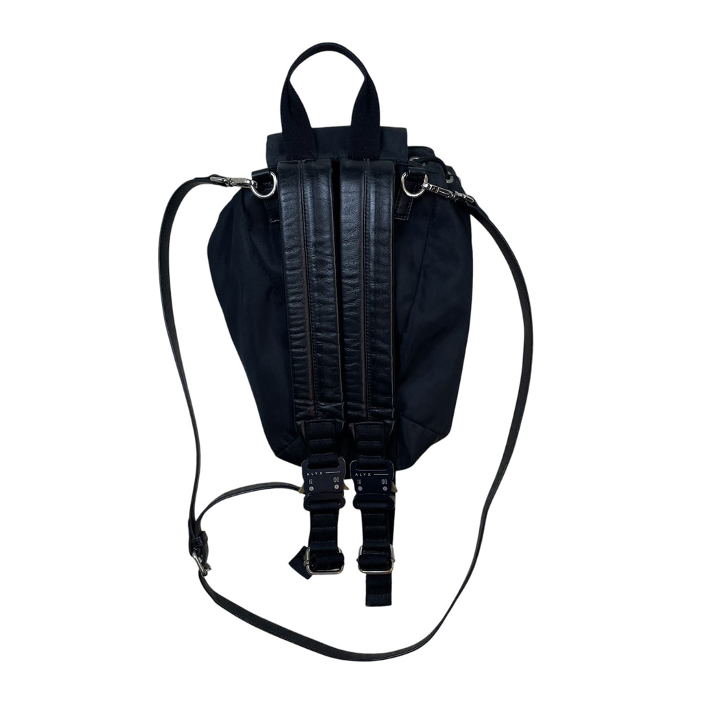 Zenno Archive black nylon backpack featuring signature metal buckle closures and adjustable leather shoulder straps