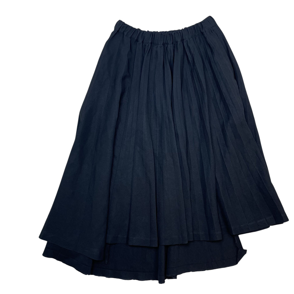 Zenno Archive black Comme des Garcons pleated skirt with an elastic waistband and asymmetrical hemline.