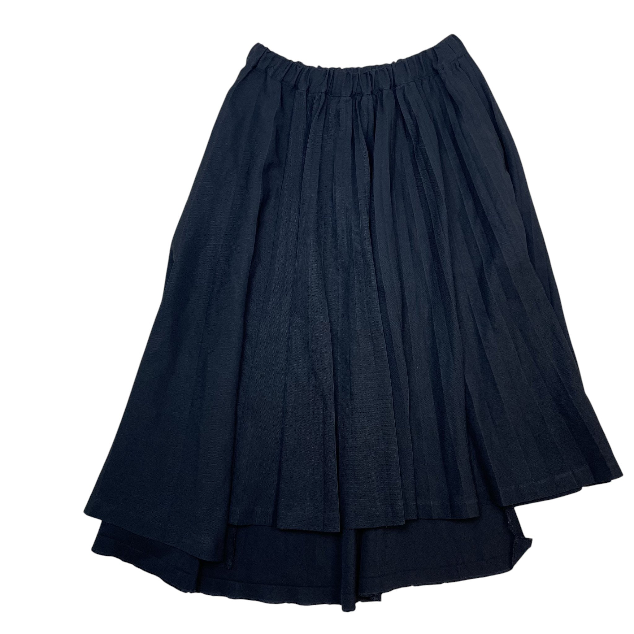 Zenno Archive black Comme des Garcons pleated skirt with an elastic waistband and asymmetrical hemline.