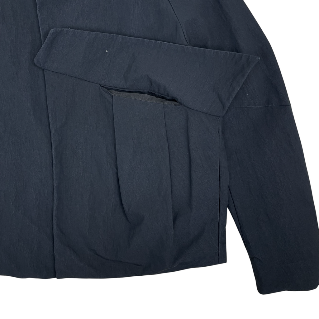 Zenno Archive Common Divisor Vale stand collar jacket in black featuring a unique pleated pocket design