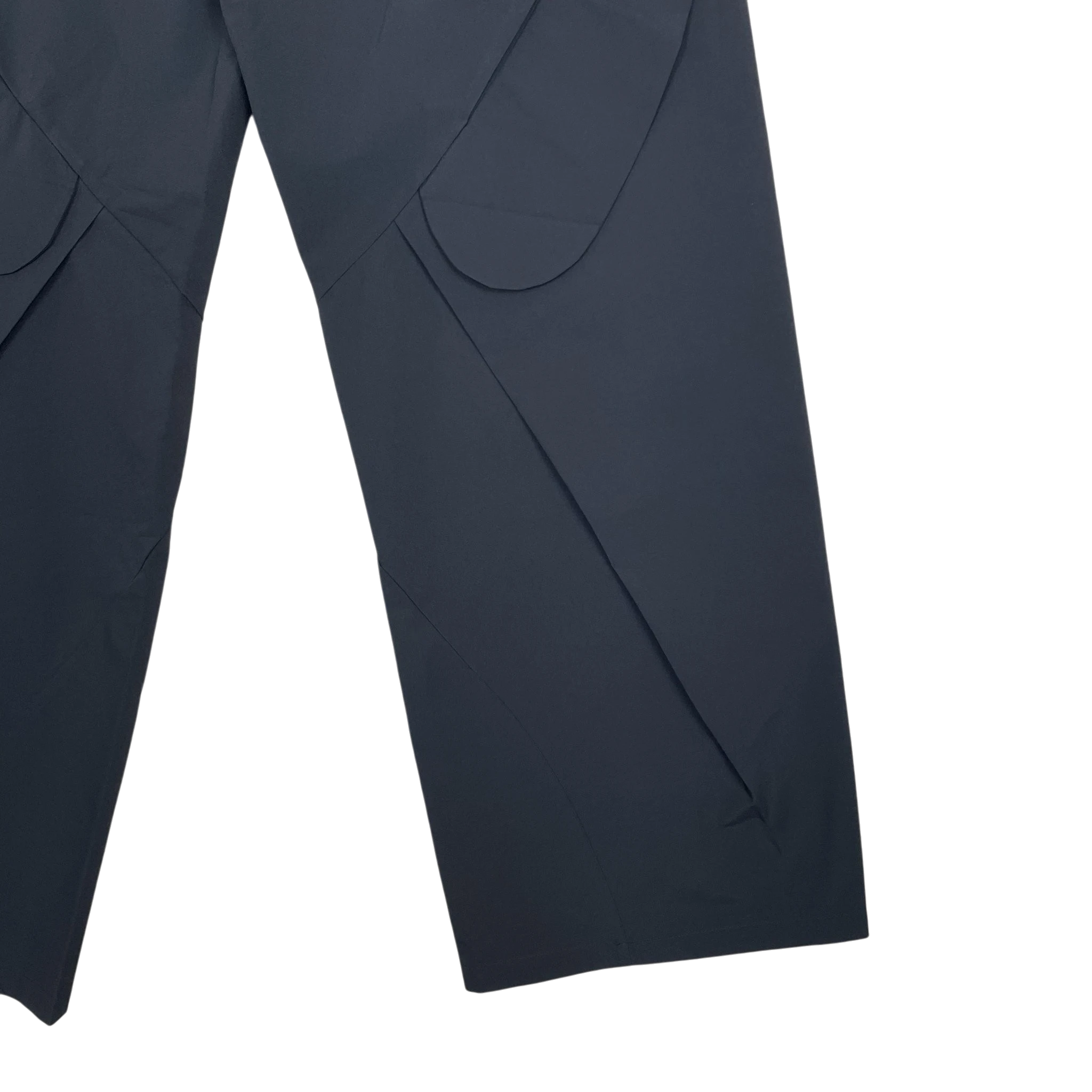 Zenno Archive Nouveou Project black technical trousers featuring unique pocket flap detailing and structured seams.