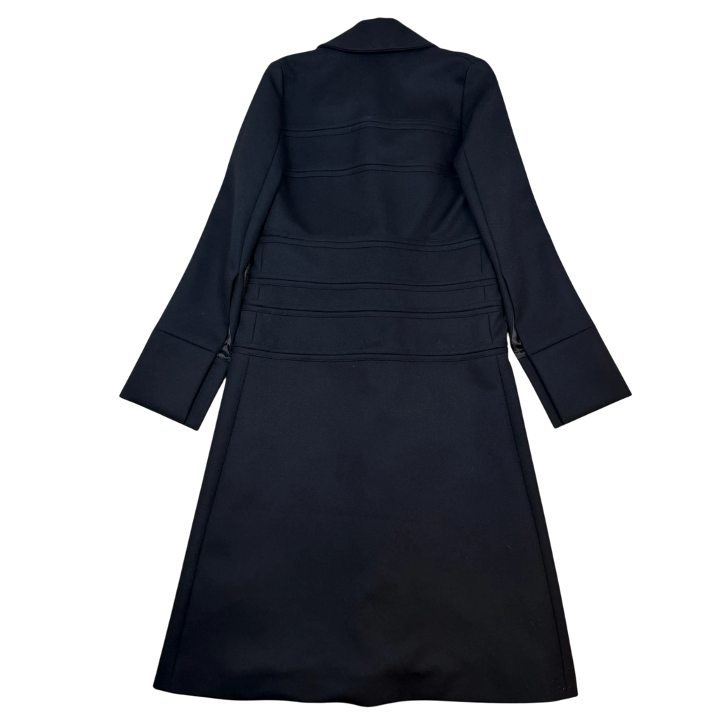 Zenno Archive black wool coat featuring horizontal strap detailing and a structured collar, back view.