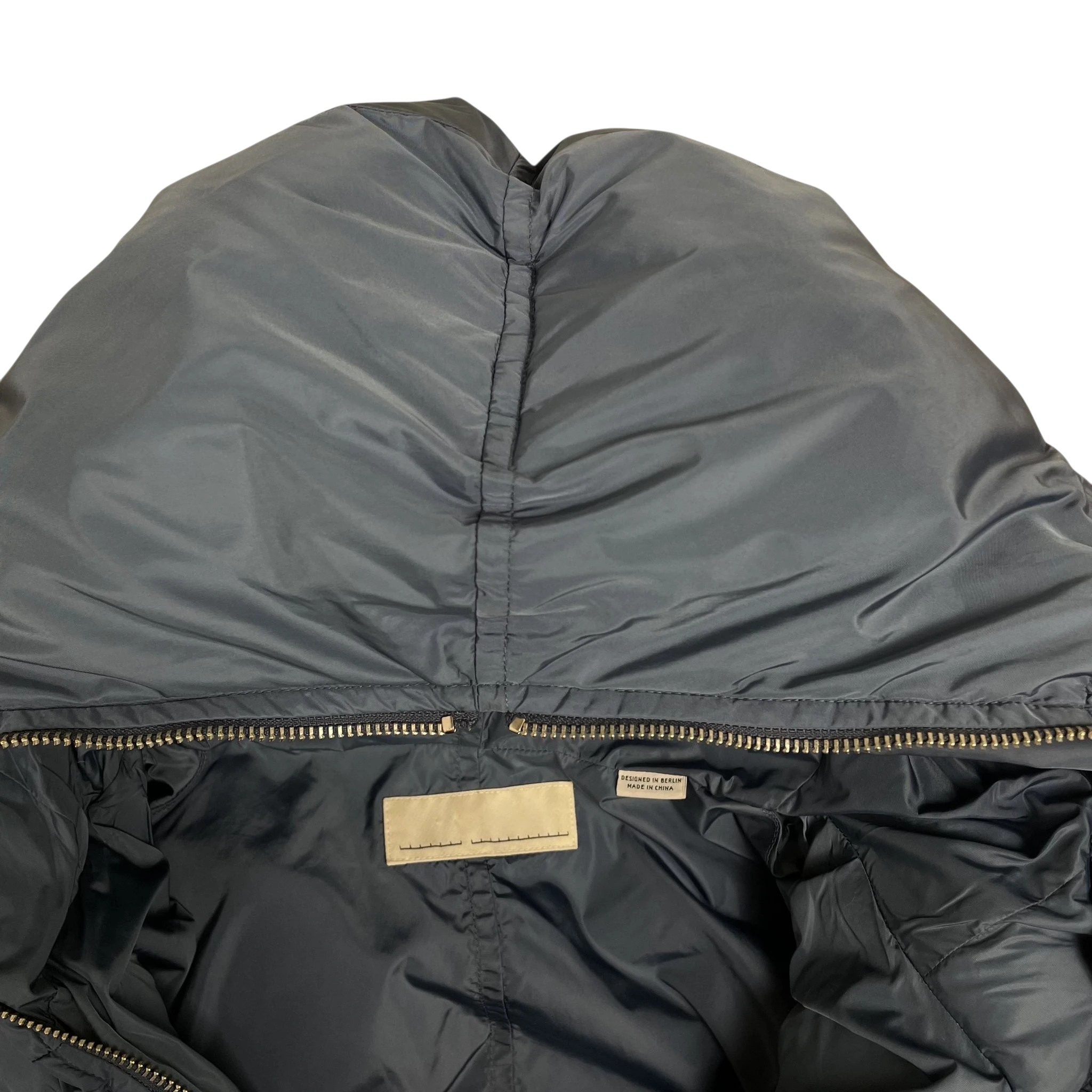Zenno Archive Random Identities blue duvet puffer jacket hood with interior branding label and zipper detail