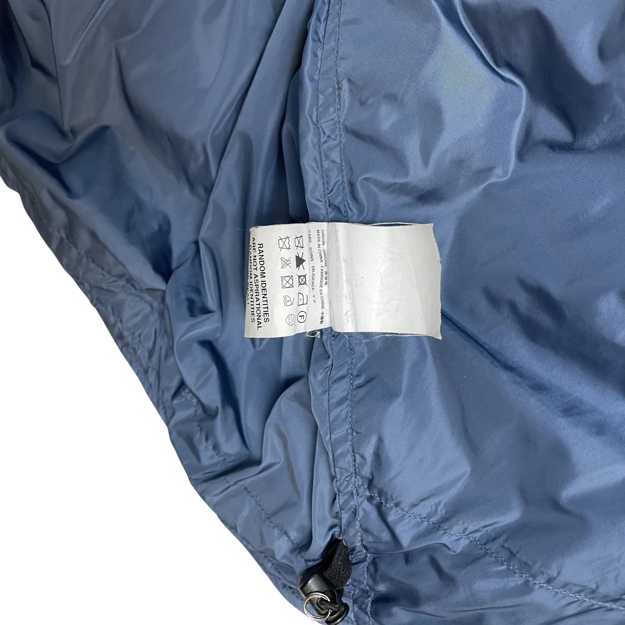 Zenno Archive Random Identities blue duvet puffer jacket care label and interior fabric detail