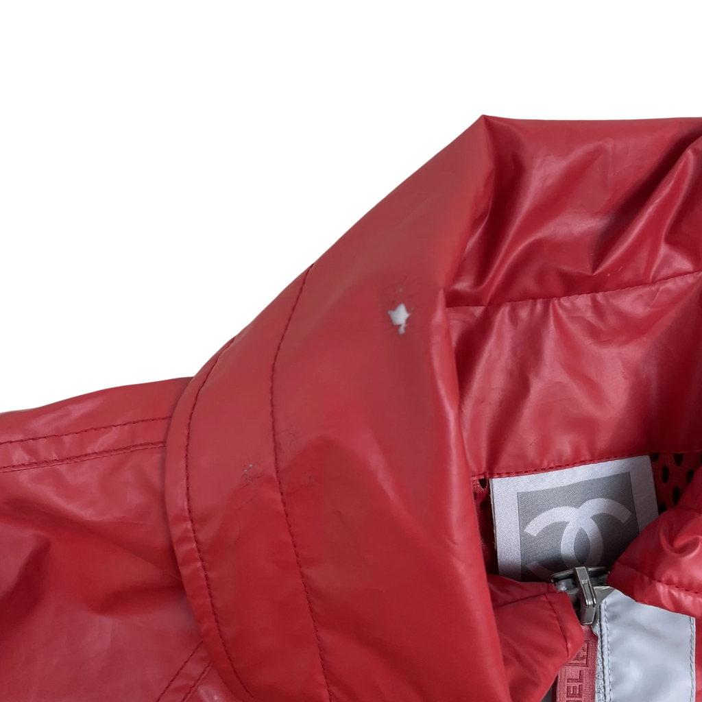 Zenno Archive vintage Chanel Sport red polyester rain coat with iconic logo tag and high collar detail