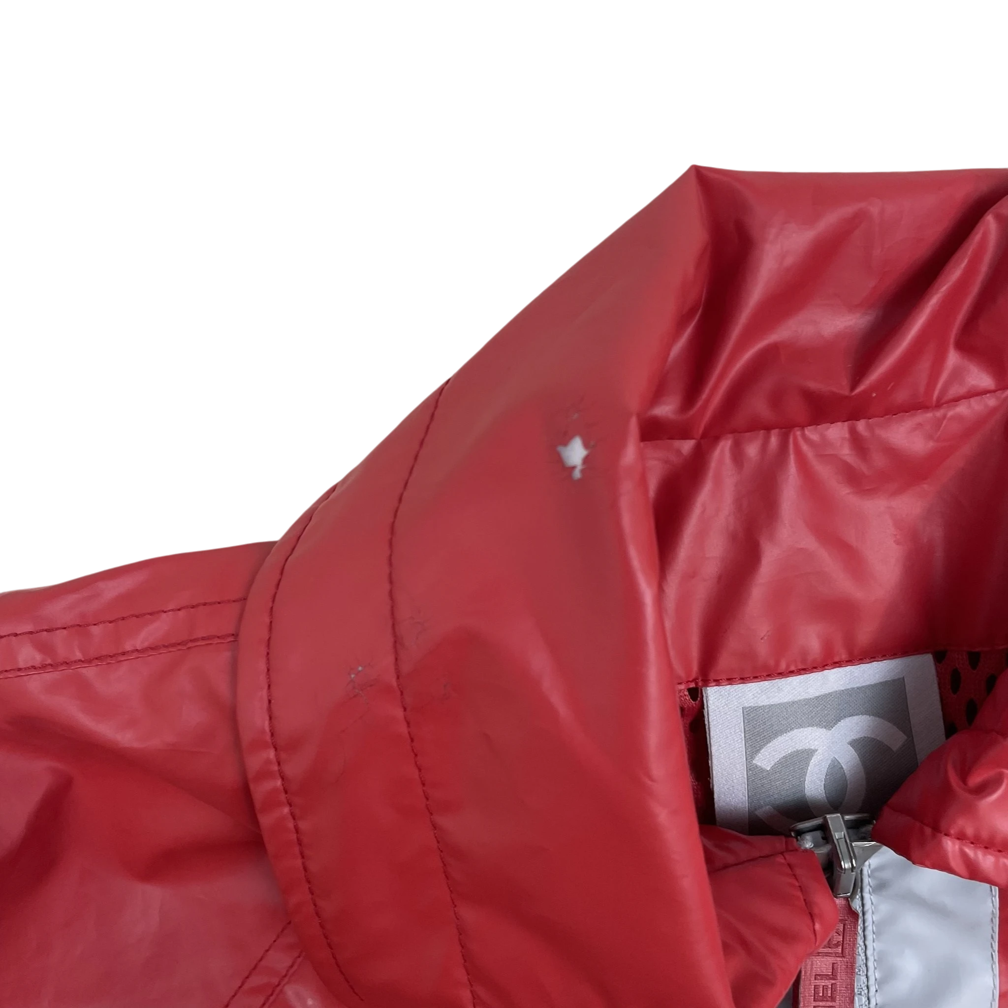 Zenno Archive vintage Chanel Sport red polyester rain coat with iconic logo tag and high collar detail