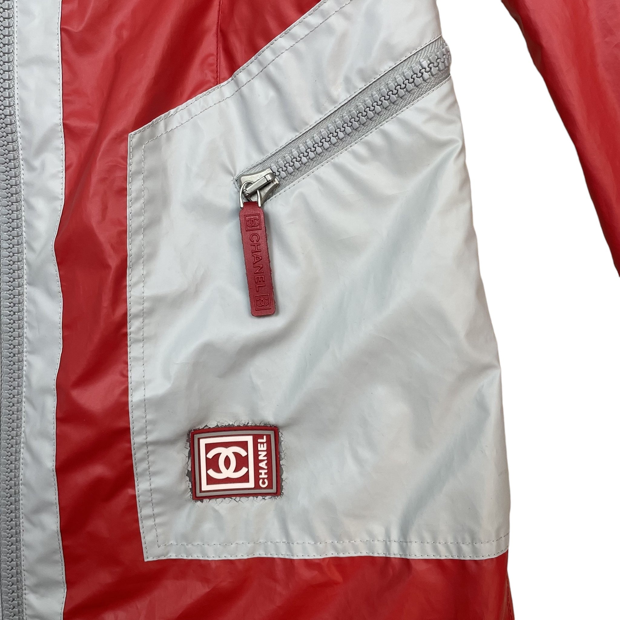 Zenno Archive vintage Chanel Sport red and grey polyester rain coat with zippered pocket and logo patch
