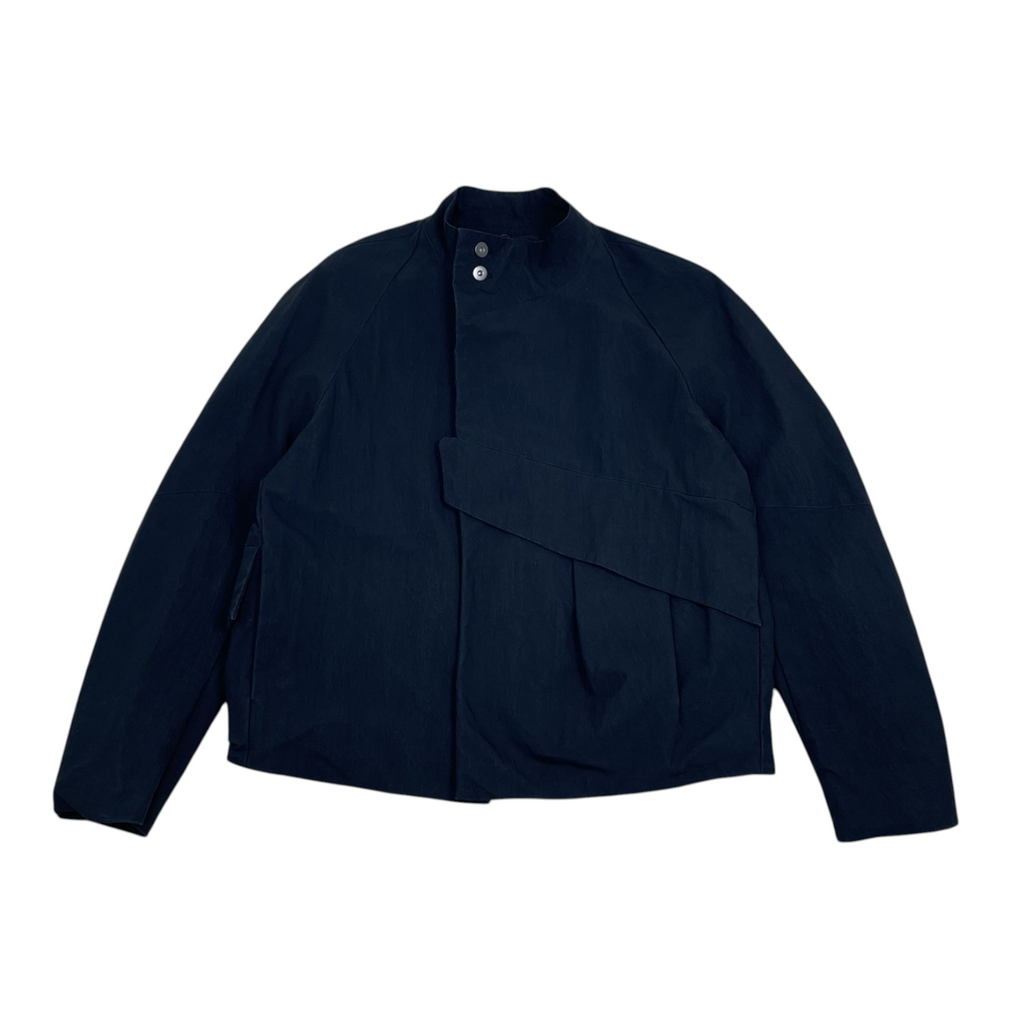 Zenno Archive Common Divisor Vale black stand collar jacket with a minimalist design and button closure.