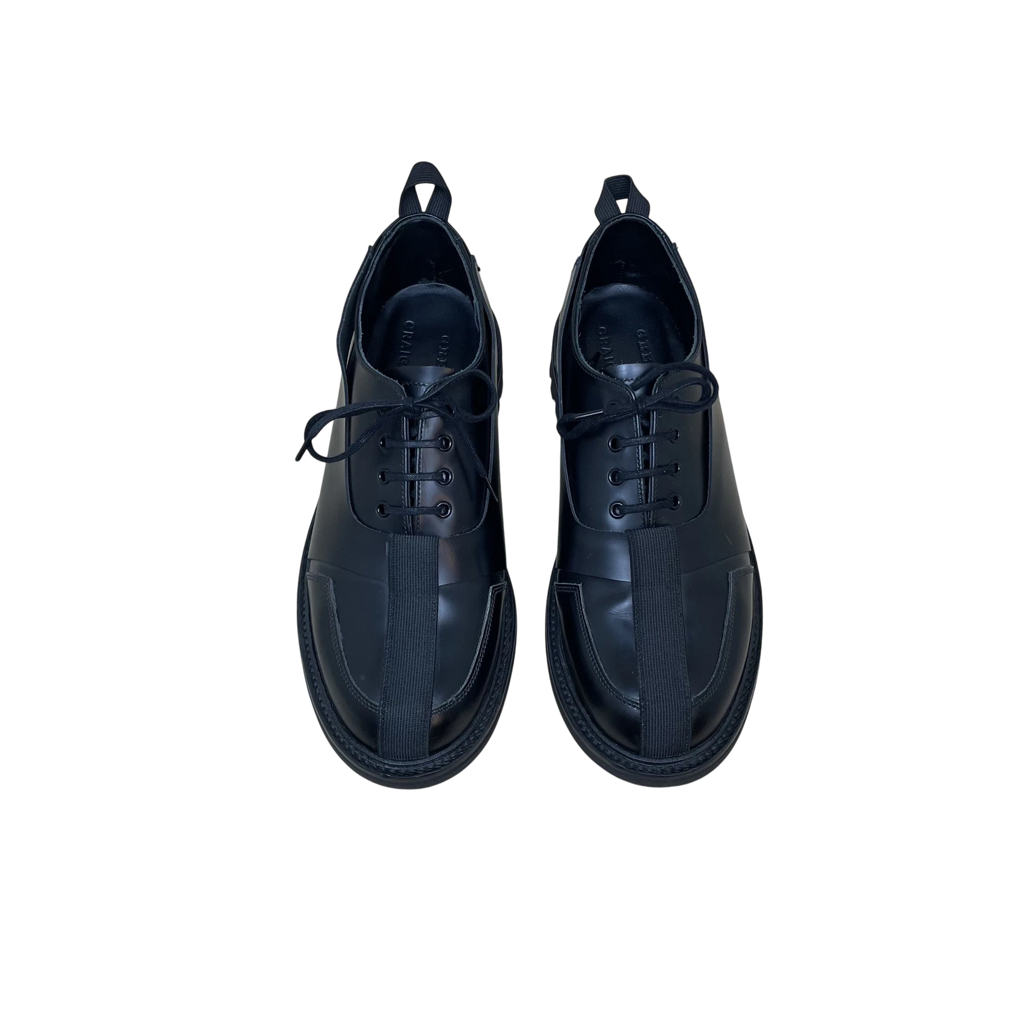 Zenno Archive Craig Green x Grenson black leather Oxford Derby shoes with central strap detail and lace-up closure.
