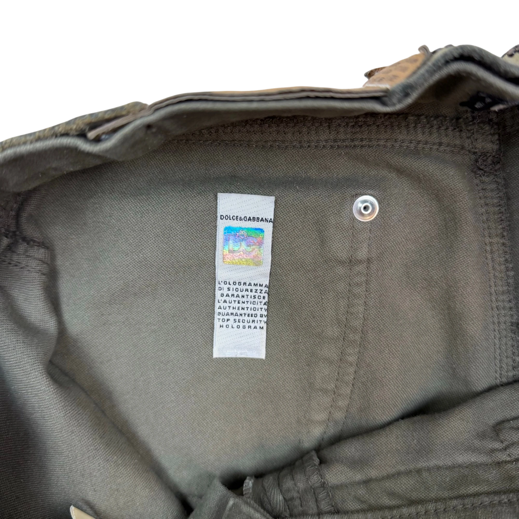 Zenno Archive Dolce & Gabbana AW03 khaki green skirt featuring an authentic holographic security tag on the label
