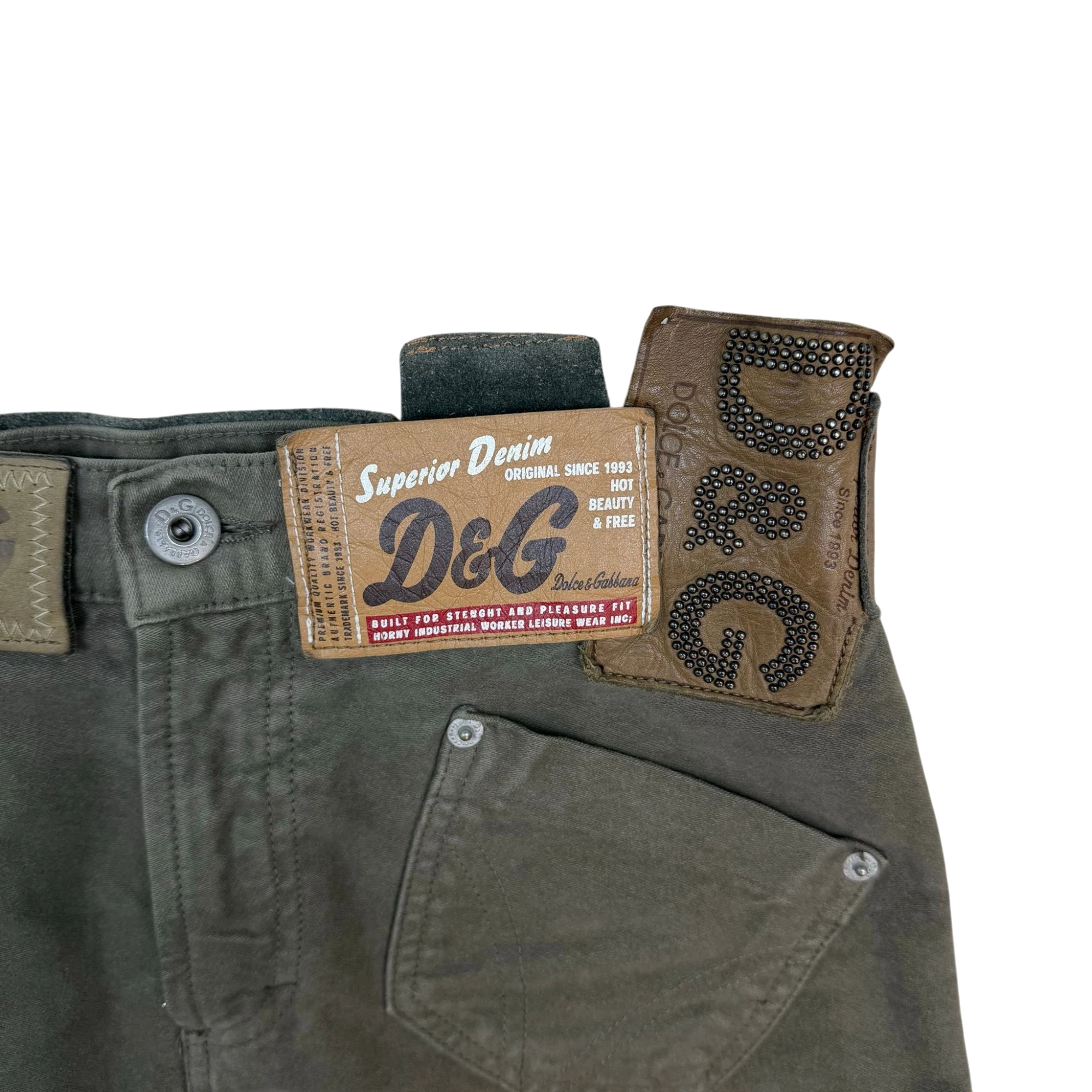 Zenno Archive Dolce & Gabbana AW03 khaki green skirt featuring multiple branded leather and denim tags with studs.