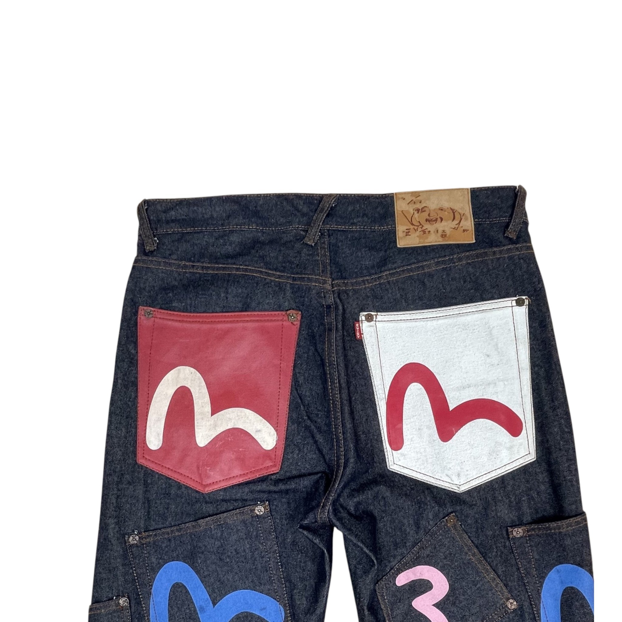 Zenno Archive Evisu multi-pocket selvedge denim jeans in dark wash with colorful painted seagull logos on back pockets.