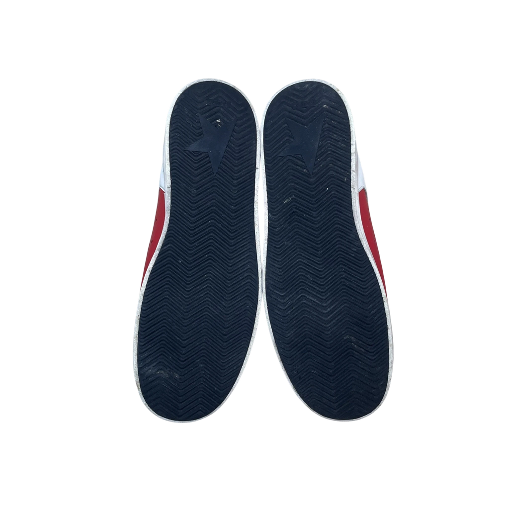 Zenno Archive Golden Goose Stardan leather sneakers in red and white, showing the black rubber outsoles.
