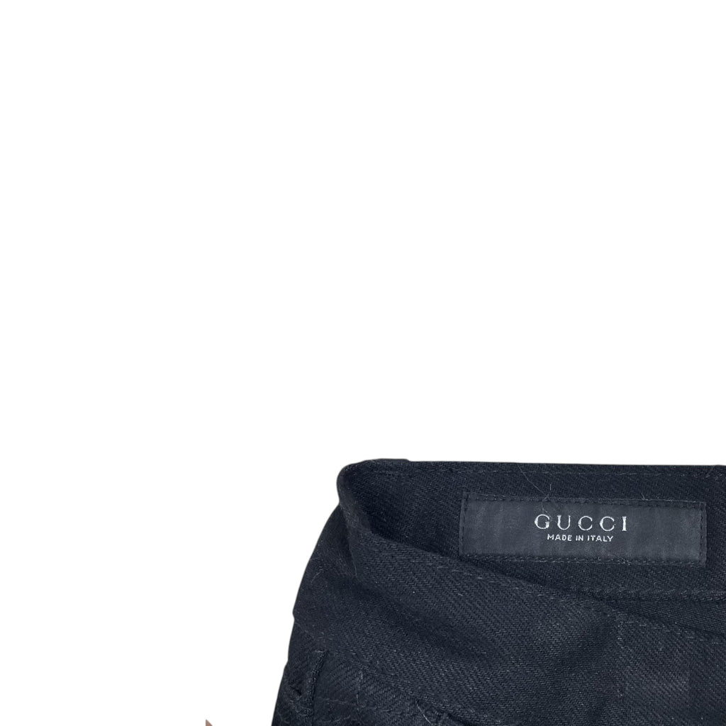 Zenno Archive Gucci AW25 black denim jeans featuring an interior waistband label and branded metal button