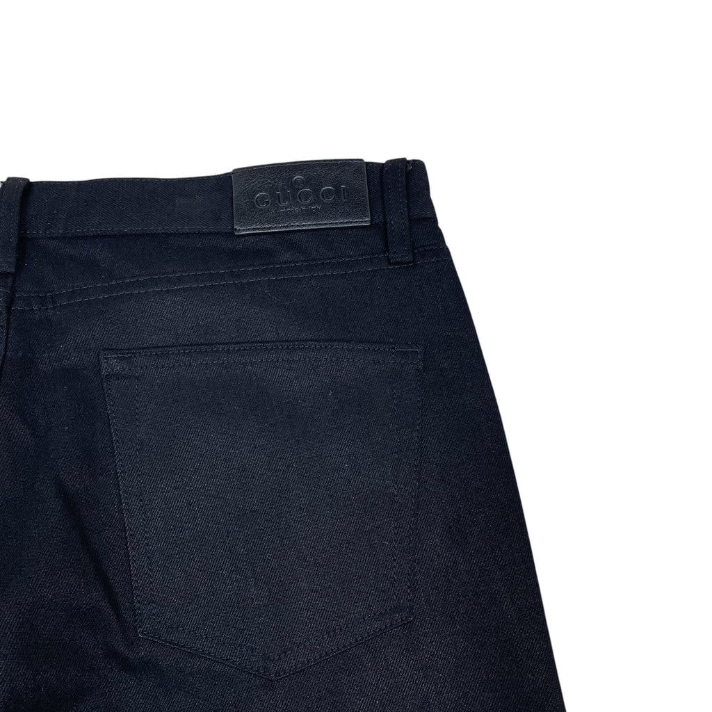 Zenno Archive Gucci AW25 black denim jeans featuring a leather brand patch on the back waistband