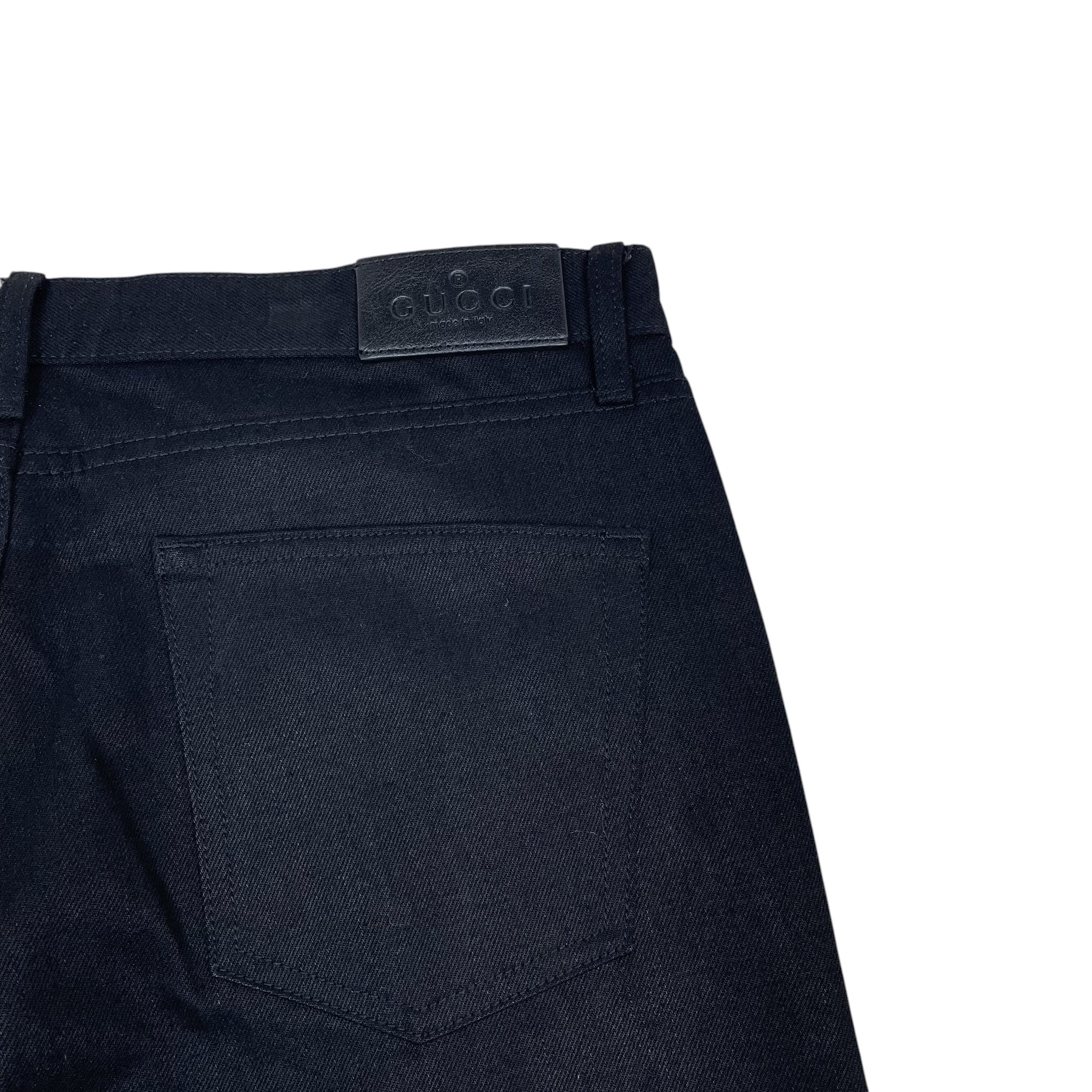 Zenno Archive Gucci AW25 black denim jeans featuring a leather brand patch on the back waistband