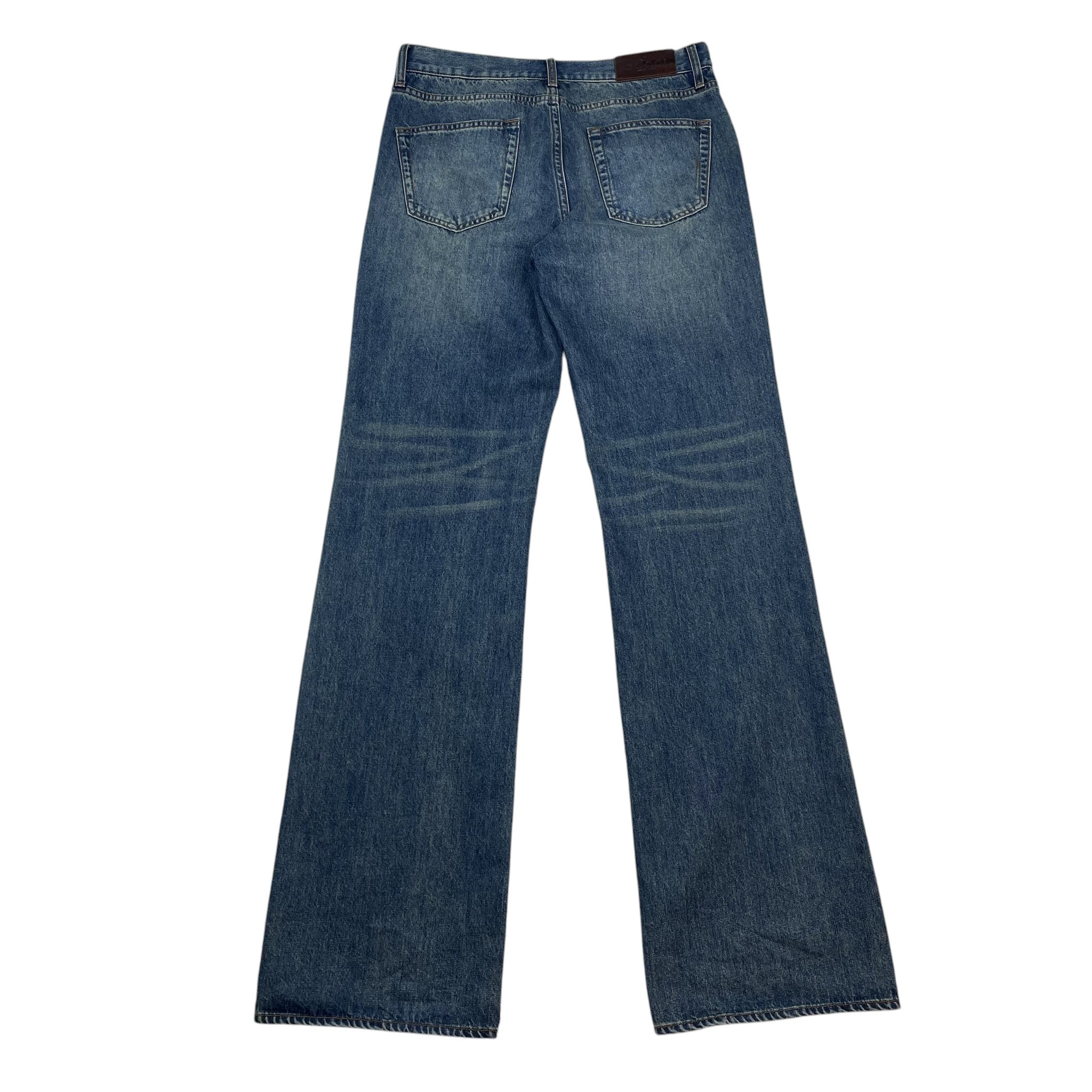 Zenno Archive Gucci AW25 washed blue denim jeans with back pockets and leather brand patch, rear view.