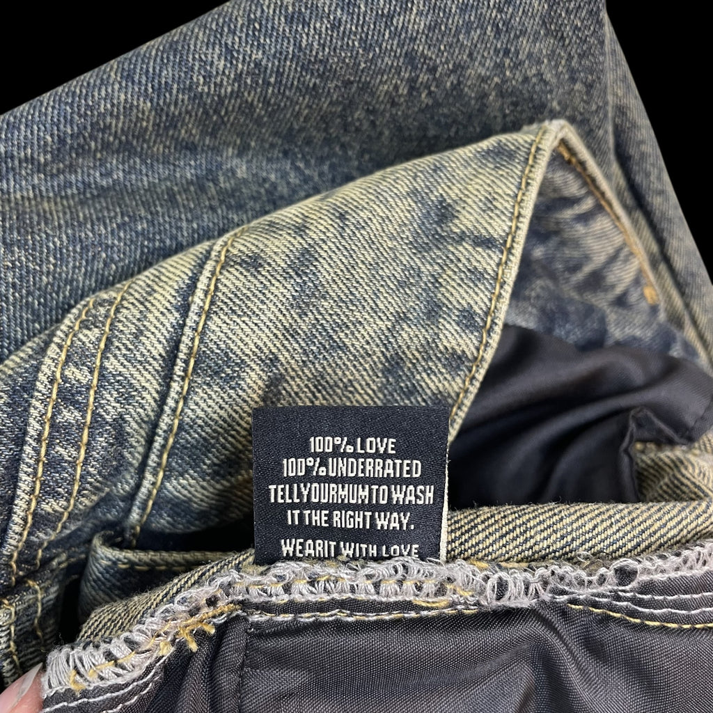 Zenno Archive NO/FAITH STUDIOS heavy wave jeans interior label with 100% love care instructions in blue denim
