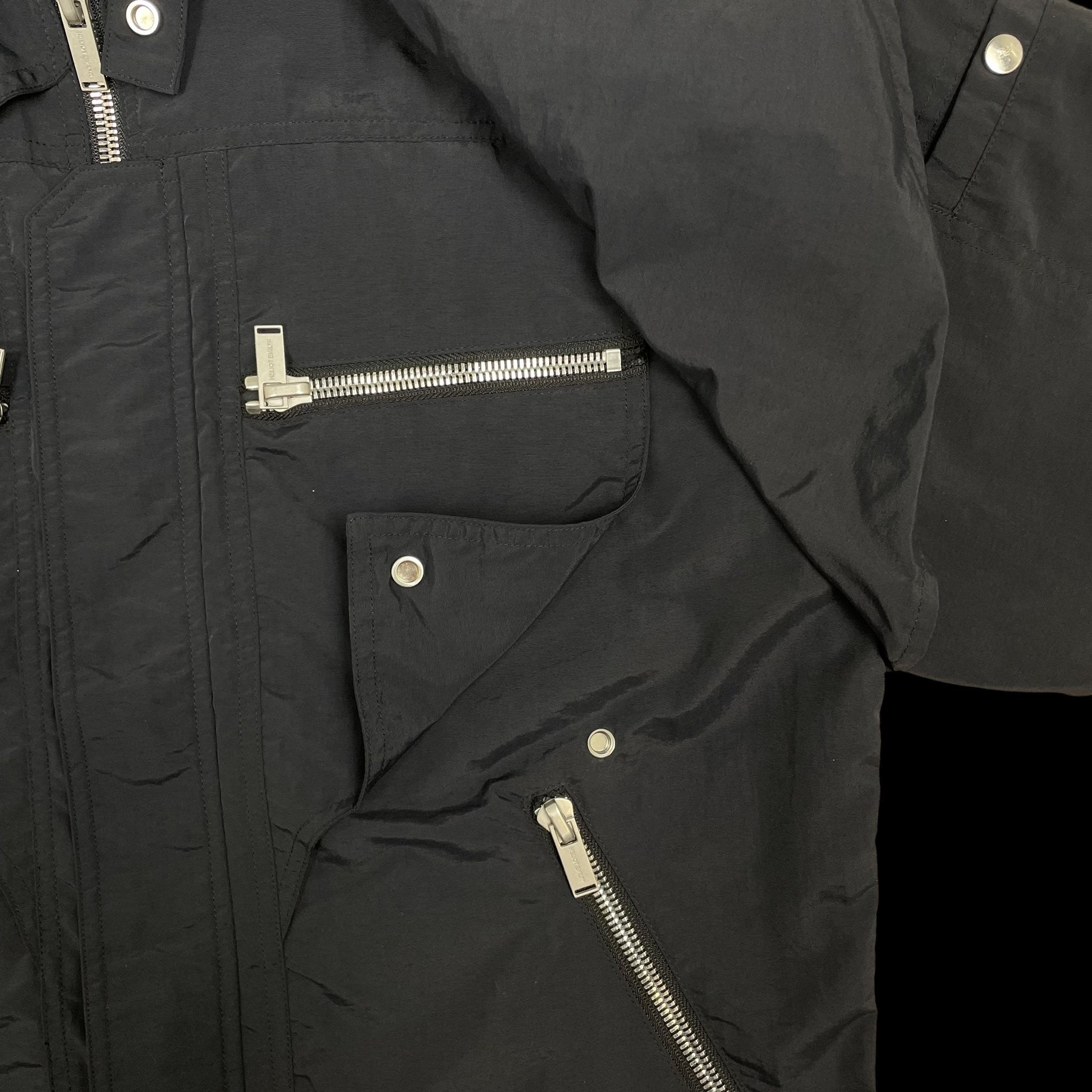 Zenno Archive Heliot Emil black layered technical nylon shirt featuring silver metal zippers and snap button details.