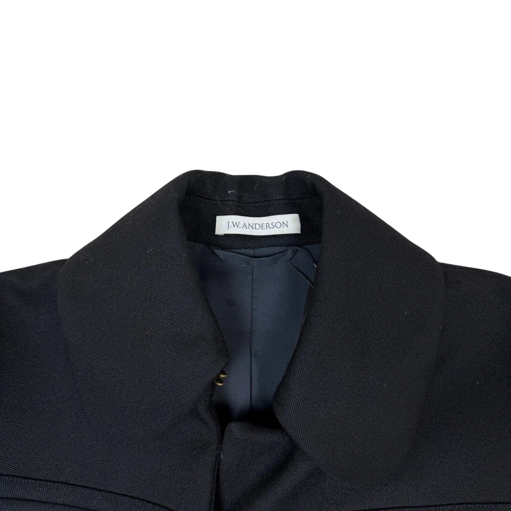 Zenno Archive black wool coat featuring a classic collar and JW Anderson interior brand label