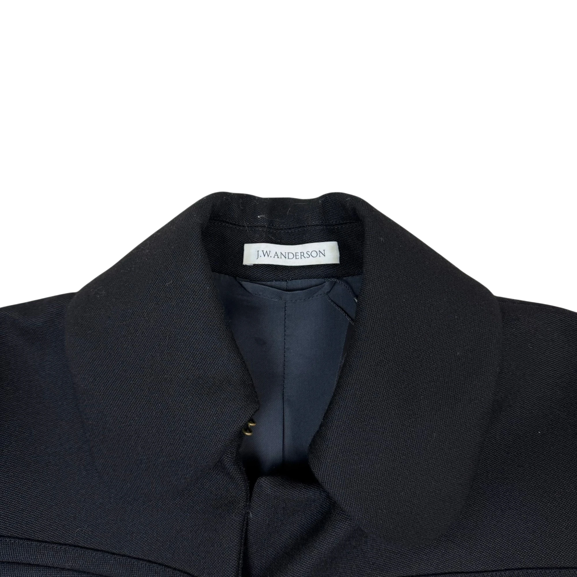 Zenno Archive black wool coat featuring a classic collar and JW Anderson interior brand label