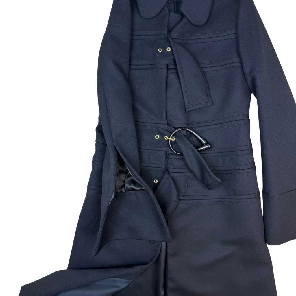 Zenno Archive JW Anderson black wool coat featuring multiple straps, gold-tone hardware, and a unique buckled waist.