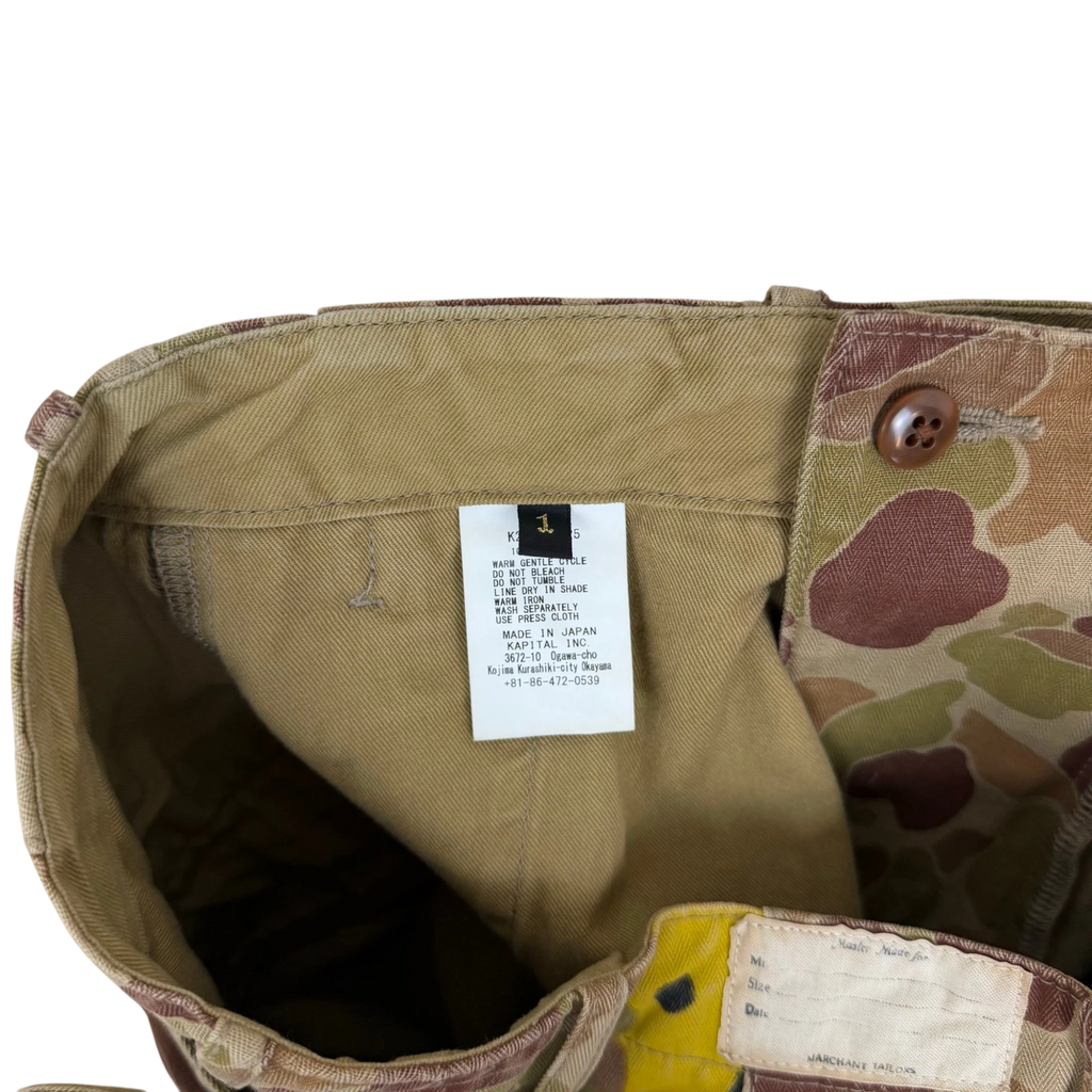 Zenno Archive Kapital herringbone camouflage pants interior care label and size tag detail