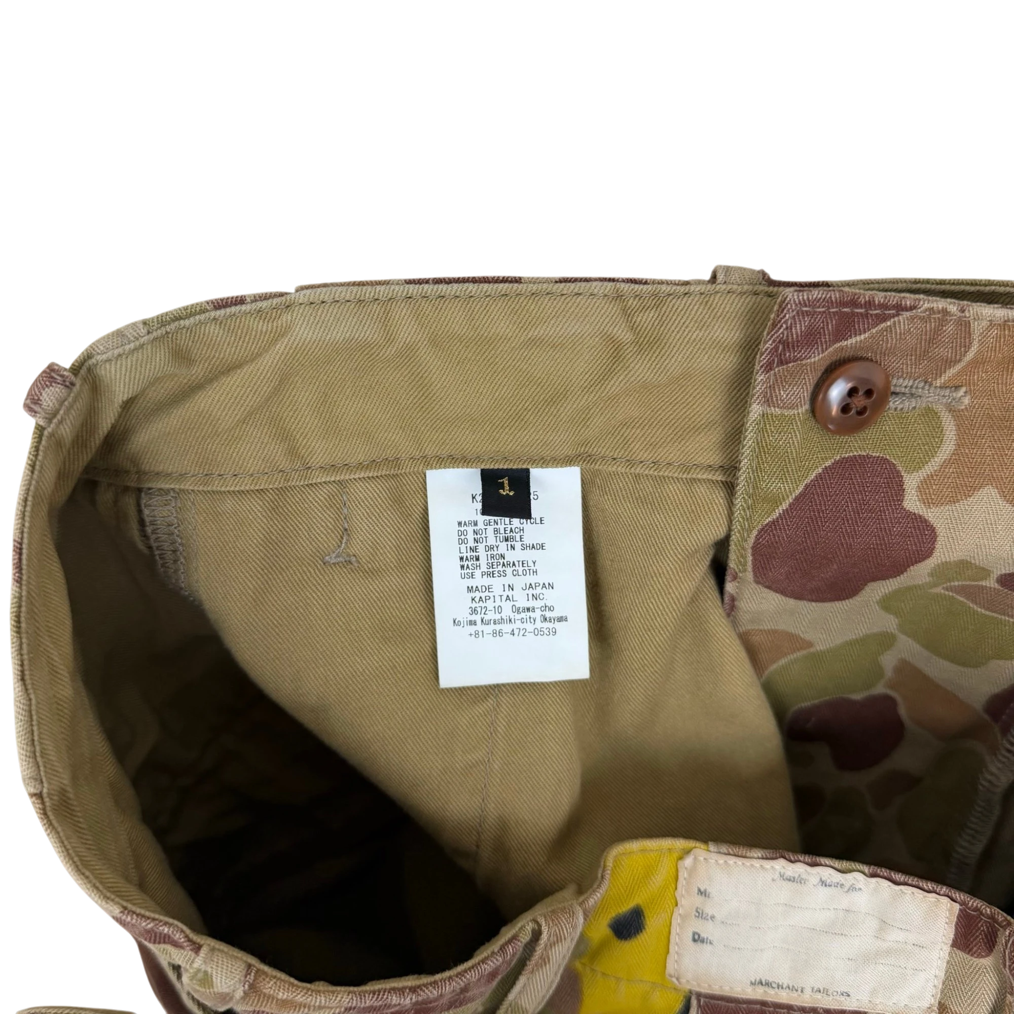 Zenno Archive Kapital herringbone camouflage pants interior care label and size tag detail