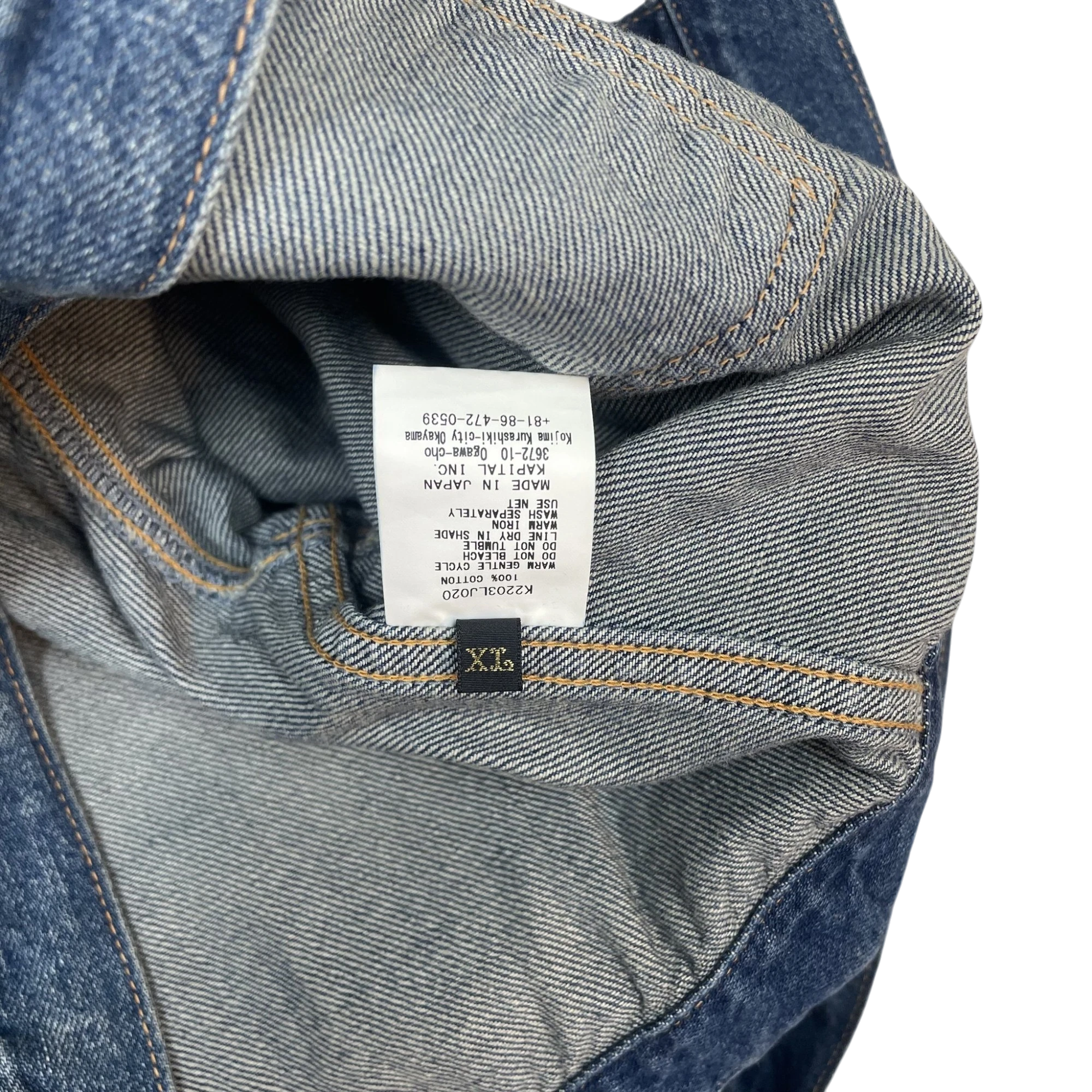 Zenno Archive Kapital Windowpane denim jacket interior label showing 100% cotton material and made in Japan details
