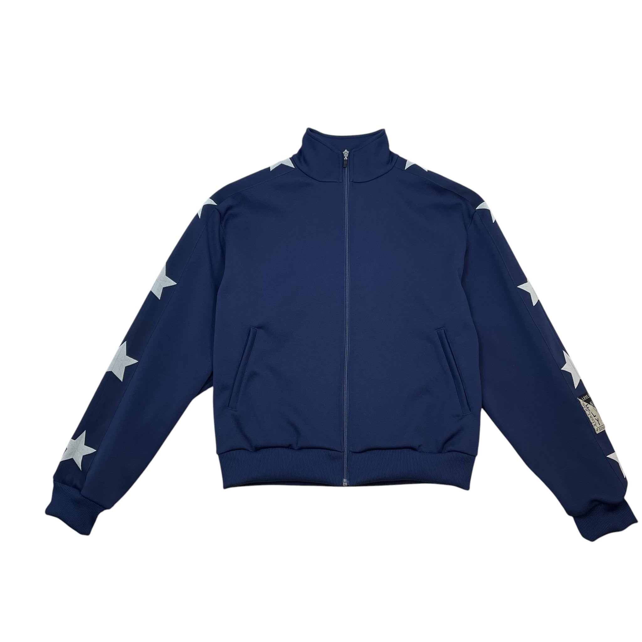 Zenno Archive Kapital navy smooth jersey track jacket featuring white star patterns along the sleeves and a zip front.
