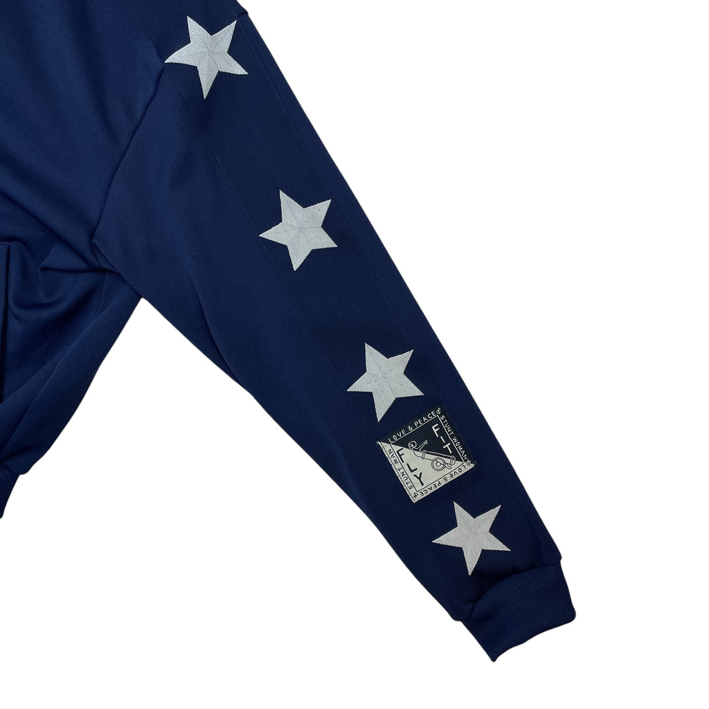 Zenno Archive Kapital navy smooth jersey track jacket sleeve with white star patches and Stuntman graphic detail