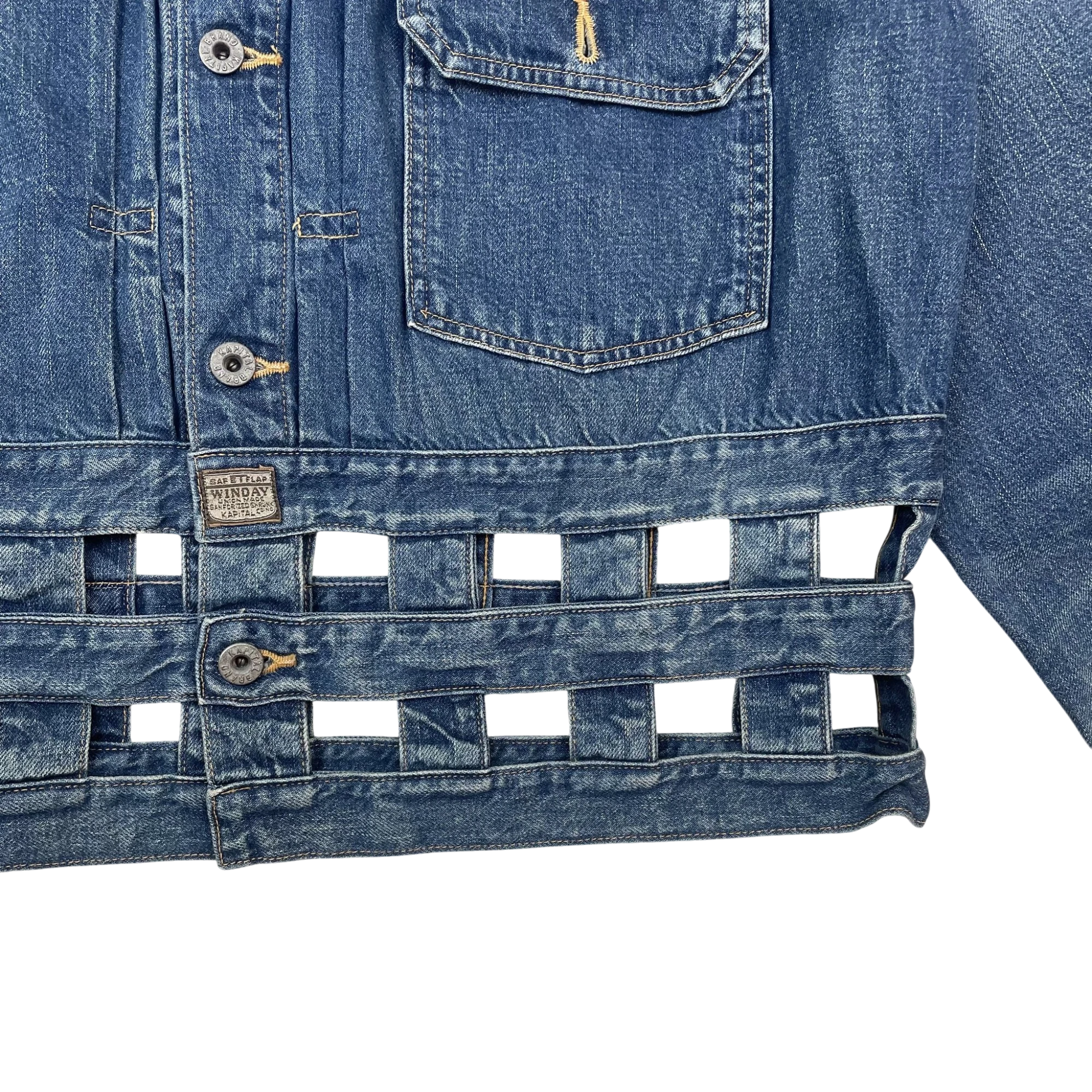 Zenno Archive Kapital blue denim jacket featuring a unique woven windowpane cutout hem and metal button detailing.