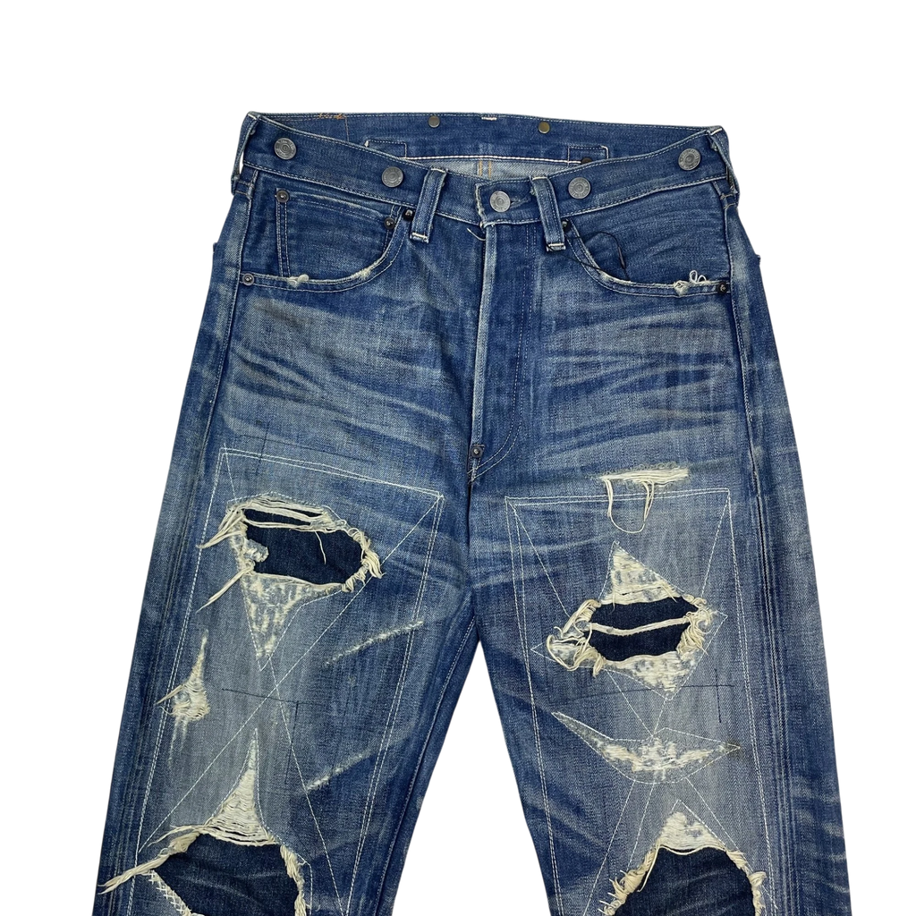Zenno Archive Levi’s LVC 33501xx blue denim jeans with heavy distressing, star-shaped stitching, and button fly.