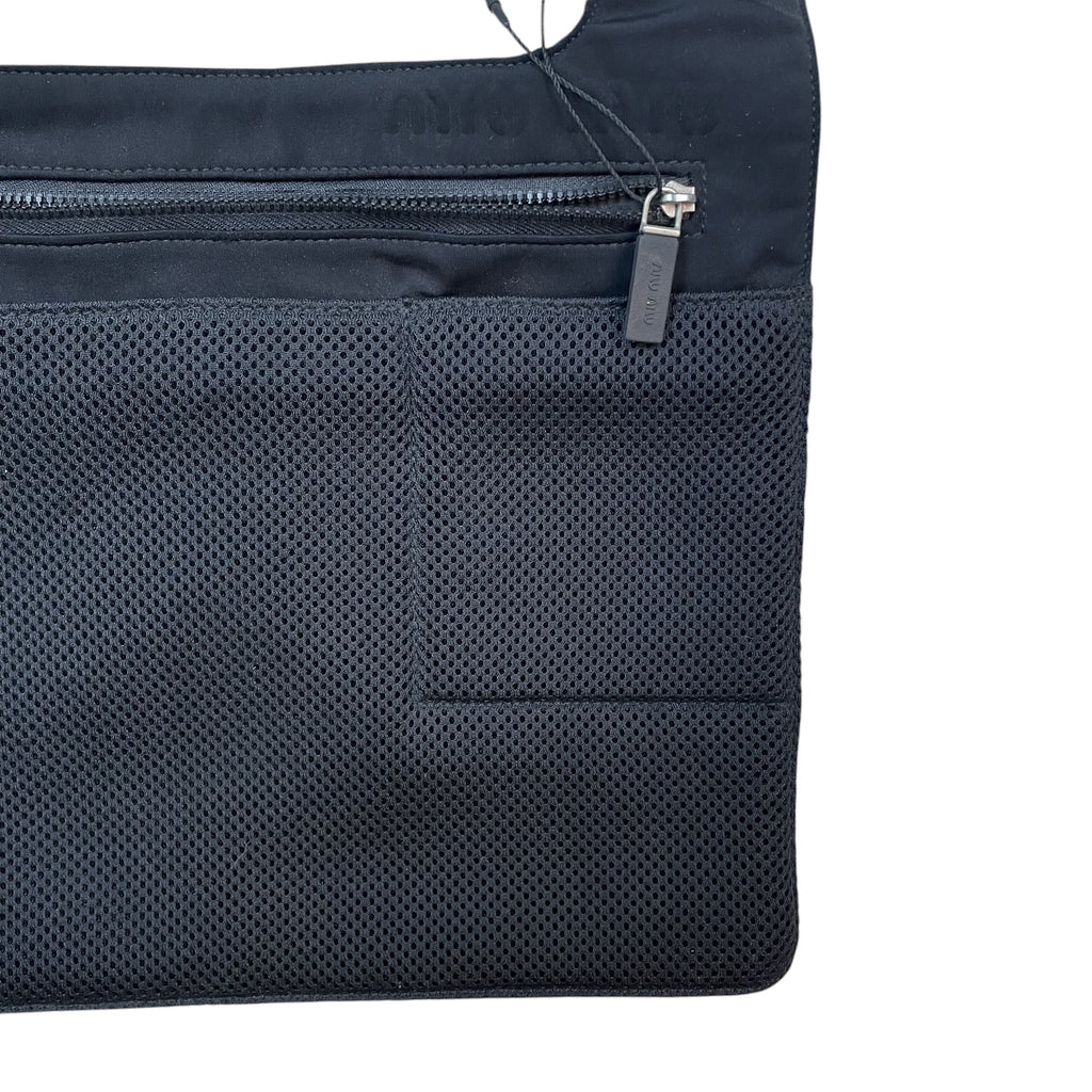 Zenno Archive Miu Miu SS1999 black mesh satchel bag with a zippered front pocket and branded pull tab