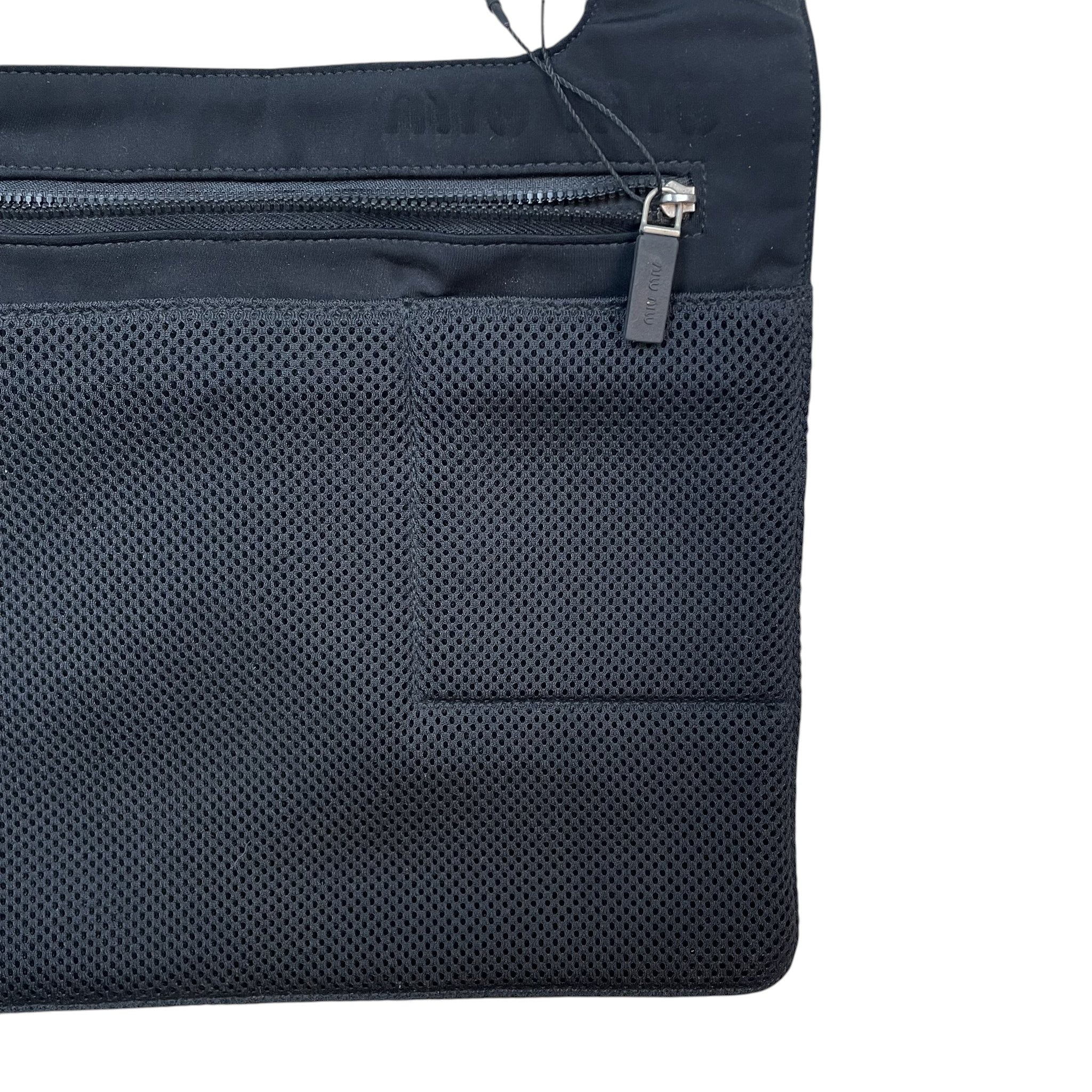 Zenno Archive Miu Miu SS1999 black mesh satchel bag with a zippered front pocket and branded pull tab